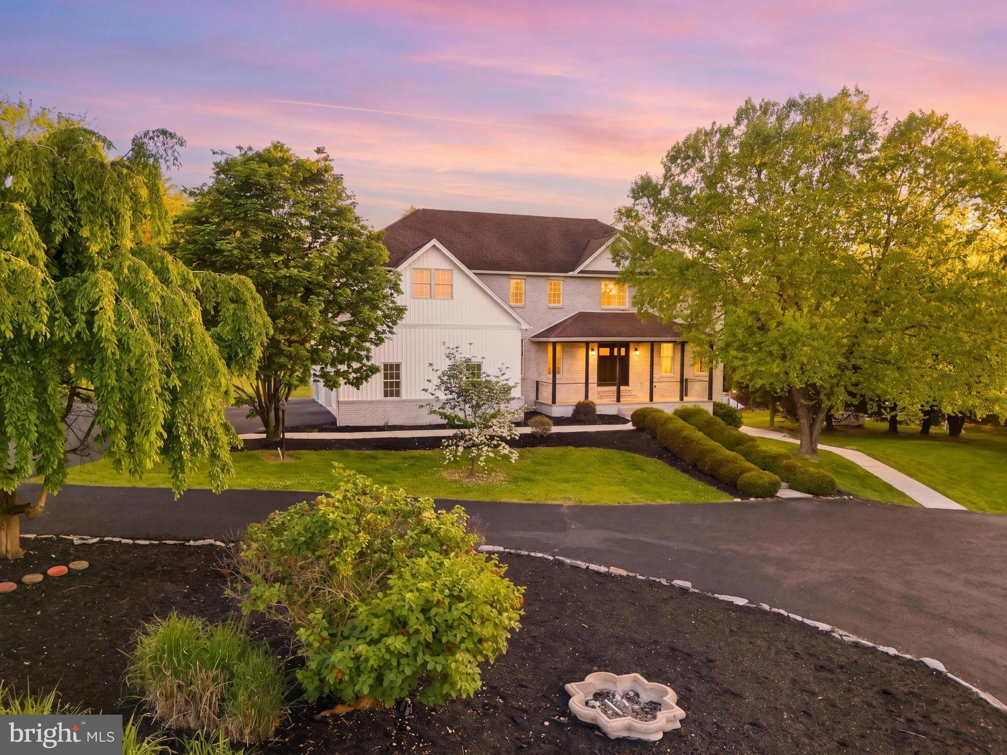 Welcome to 7 Beverly Court - a truly exceptional hidden gem in Carlisle where luxury, craftsmanship, and resort-style living come together on 1.66 breathtaking acres within Carlisle Area School District. Freshly completed and transformed from top to bottom, this absolutely remarkable residence offers more than 5,500 square feet of beautifully reimagined living space designed to impress at every turn. From the moment you arrive via the circular driveway and approach the inviting covered front porch with fresh, new modern cable railings and a striking new front entry door, the attention to detail and elevated design are undeniable. Inside, a grand foyer opens to sophisticated yet comfortable living spaces featuring refinished hardwood flooring, updated finishes, and thoughtfully curated details throughout. At the heart of the home is the stunning custom kitchen, designed for both everyday living and entertaining, showcasing custom cabinetry, expansive quartz surfaces, an oversized center island, herringbone ceramic tile backsplash, custom hood, oversized farmhouse sink, premium appliances, and seamless flow into the breakfast dining area and welcoming family room anchored by a gas fireplace adorned with wainscoting and new wood mantle. The main level offers incredible flexibility with multiple gathering spaces including an elegant formal living room, formal dining room with coffered ceiling and custom judges paneling, a dedicated office, playroom, or optional sixth bedroom, a beautifully updated powder room, and a functional laundry and mudroom area with direct access to the side-load two-car garage. Upstairs, the home continues to impress with five spacious bedrooms and four full bathrooms, including an extraordinary owner’s retreat designed to feel like a private luxury escape. The primary suite features an expansive sitting area, dual walk-in closets, and a spa-inspired bath complete with dual vanities, a custom tile shower, and a freestanding slipper tub. The finished walk-out lower level creates an entirely new layer of living and entertaining space with a large recreation room, second fireplace, custom wet bar with butcher block counters, fitness room with specialty flooring, and an additional half bath. Direct access leads outdoors where the experience becomes absolutely unforgettable. The backyard is your very own private retreat featuring an in-ground heated pool complete with diving board, slide, gas/propane heater, expansive patio and newly refinished deck featuring new cable railing, and a brand-new security fence securing the pool area, all surrounded by mature landscaping and the beauty of this incredible setting. Extensive improvements include a completed luxury renovation with fresh interior and exterior paint, custom kitchen installation, quartz countertops, upgraded appliances, fully renovated bathrooms, updated lighting & fixtures, refinished and new flooring, serviced HVAC systems, electrical updates, new siding, exterior enhancements, and professional landscaping. Opportunities like this are exceptionally rare - a fully renovated luxury property offering scale, character, modern updates, and resort-style outdoor living in one of Carlisle’s most desirable settings. Schedule your private showing today and experience everything 7 Beverly Court has to offer. Please ask for the complete list of updates and improvements.