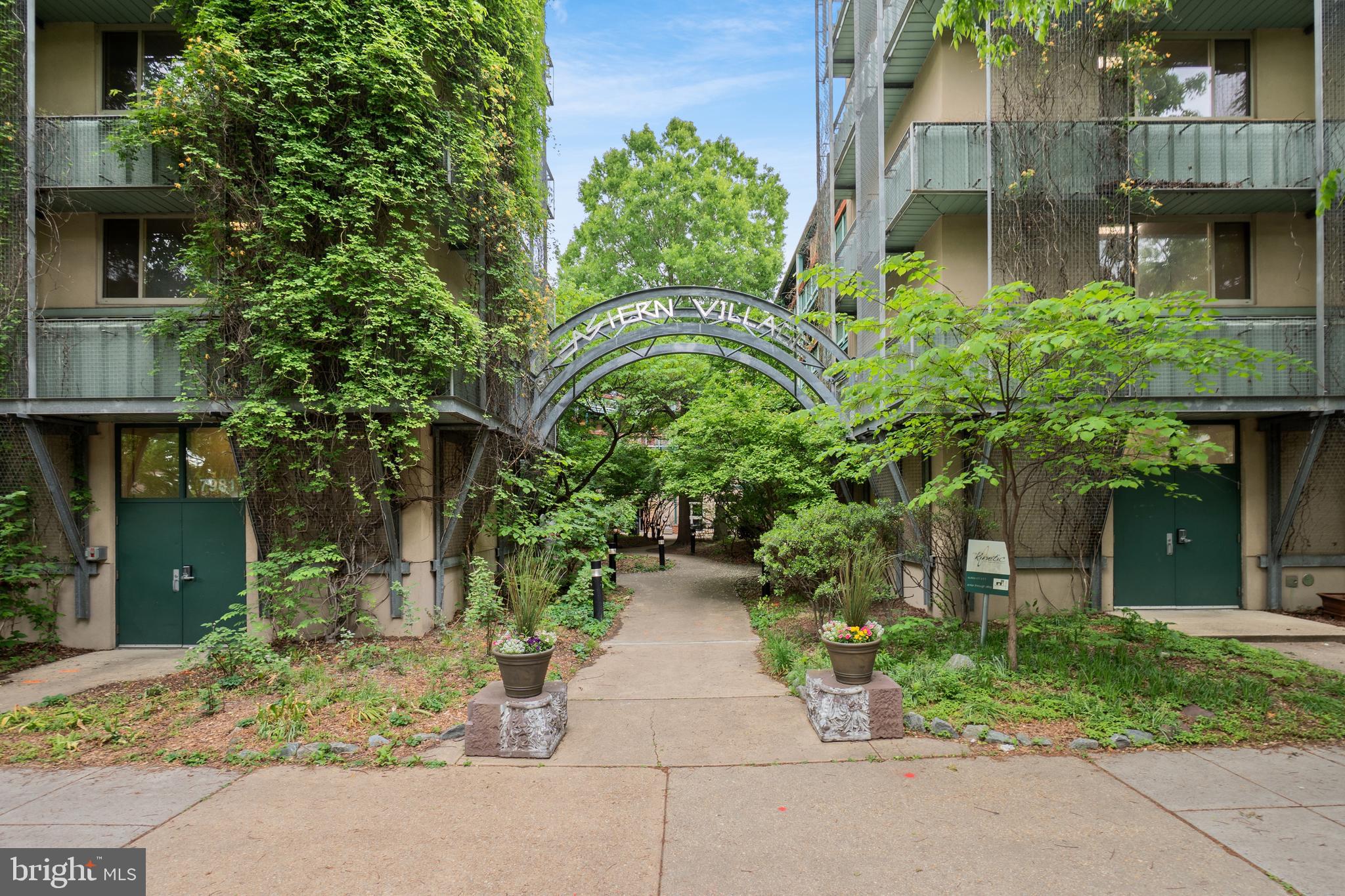 Are you looking for instant community where neighbors genuinely care about one another, as well as come together to keep the condominium wheels greased and running smoothly? Then the co-housing concept may be for you! Welcome to this spotless, freshly painted unit in the vibrant Eastern Village Co-Housing Condominium that prides itself on never having needed a special assessment! In 2005, this was one of the first LEED Silver certified residential buildings in the area. With two bedrooms, a full bathroom, a half bathroom, multiple closets plus built-ins, it has plenty of space in which to live comfortably. Being on the second floor and southwest facing, Unit 219 gets nice natural light. The floor plan is open with ample room for entertaining. The kitchen is modern and in wonderful condition, with quartz counters and gas cooking. Unlike many units in the community, this one has its own washer and dryer. It also has two assigned planters outside the unit on the common balcony for herbs, flowers, etc.

The condo fee for this unit is $665.84 per month and includes gas, water/sewer, hot water, basic Wi-Fi, free laundry, professional management, common area maintenance and use of the many common area amenities. Owners only pay electricity for their individual units. While basic Wi-Fi is provided, unit owners also have the right to purchase their own cable/internet based on their needs. The community has a geothermal system built below the common courtyard that supplements the heating and cooling needs of the individual units so that the in-unit heat pumps work more efficiently. Amenities include an expansive walkable green roof with a covered gazebo, playground, bike storage shells, an area to air-dry clothing and a stunning view. There are “share closets” where residents can store items that they are willing to share with other residents like car racks for bicycles, vacuum cleaners, luggage, ladders, etc. In addition to the bicycle storage shells on the roof, there are other areas in the building designated for bicycle storage. There is a community kitchen and seating area for large gatherings, a common living room with a fireplace and big-screen TV, a teen gathering/game room, a kid’s playroom, a fitness room, a crafting/woodworking room, a library/music room and a computer room.  Additionally, Eastern Village has guest suites that can be rented for $20/night for visiting family and friends.

A big plus for this condo is its proximity to the Silver Spring Metro ( 4 blocks) and all the grocery stores, restaurants, bars, gyms and shopping options nearby. Street parking is available and the Montgomery County Parking Garage immediately adjacent to Eastern Village provides discounted monthly rates to Eastern Village residents.  OPEN SUN 5/31, 2-4pm