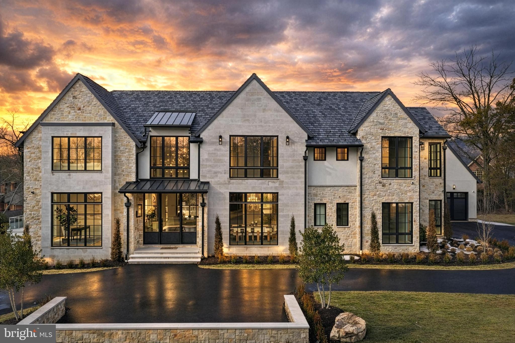 Designed to Lead: Where Architecture, Performance, and Excellence Converge. 

Rising quietly at the end of Ballantrae Court, this exceptional east-facing ultra-luxury residence located in Ballantrae Farms, one of McLean’s most prominent neighborhoods, is a study in precision, power, and restraint—crafted for those who expect more and accept nothing less. Set on 1.54 private acres with a resort-caliber pool, expansive terraces, and a thoughtfully orchestrated site plan, the home delivers presence and sophistication without compromise. 

From the moment you arrive, the architecture signals intent. A metal-and-glass entry opens to soaring 11-foot ceilings, a floating white-oak staircase framed in steel and glass, and interiors defined by balance, flow, and light. Every material is purposeful: 7” wide white-oak floors, custom transitional millwork, solid 8’ doors, and floor-to-ceiling Marvin windows that pull the outdoors in while maintaining complete control of comfort and performance through a fully integrated smart-home ecosystem. 

At the heart of the home, the kitchen is engineered for mastery. Taj Mahal quartzite slabs, bespoke white-oak cabinetry, and a full suite of Gaggenau appliances—including multiple cooking surfaces, steam, convection, and induction—create a space that is as commanding as it is refined. A secondary catering kitchen ensures seamless execution for entertaining at scale, while the adjacent great room opens through automated glass walls to a covered outdoor living room with fireplace, heaters, and travertine flooring—an effortless extension of the interior experience. 

The upper level is devoted to retreat and restoration. The primary suite unfolds as a private residence within the home, complete with sitting room, fireplace, coffee bar, automated shades, and a spa-level bath with heated floors, soaking tub, and dual water closets. Secondary bedrooms are all ensuite, each finished to the same uncompromising standard, while a glass-enclosed laundry suite and upper-level family lounge elevate daily living. 

Below, the lower level is tuned for performance and play: an entertainment lounge with walk-out access, a wet bar with curated finishes, a gym with steam shower, a dedicated media and golf simulator-ready room, and a private guest suite. Every space is supported by serious infrastructure—Crestron Home Automation and Control System, luxury elevator access to all levels, 800-amp electrical service, 4-car main level garage with EV-charging capability, generator readiness —ensuring the home performs as beautifully as it presents.  For future expansion, an optional 5th and 6th garage with apartment has gone through permitting.

This is not simply a luxury residence.  It is a statement of intent.  A home designed to lead.  Minutes to DC, Tysons, and 495.  20 minutes to both Dulles and Reagan Airports.