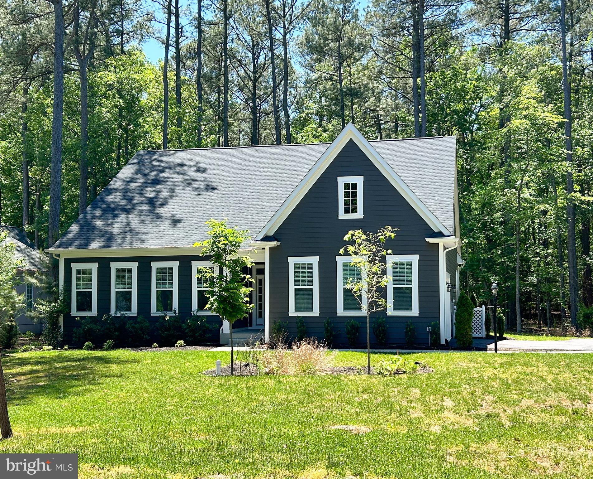 Nestled against a backdrop of trees, this home offers a serene retreat where everyday living feels calm and effortless. Designed for main-level living, it sits within a tranquil, amenity-rich community that invites you to slow down and enjoy each moment.
Just beyond the foyer, the open main living area welcomes you with a soaring two-story family room that fills with natural light and creates an airy, relaxing atmosphere. The space flows seamlessly into the kitchen, dining area, and sunroom—perfect for quiet mornings or peaceful gatherings. The kitchen is thoughtfully appointed with quartz countertops, crisp white cabinetry, and stainless steel appliances, blending modern style with everyday comfort.
Tucked just off the kitchen, the laundry room features front-loading Whirlpool® washer and dryer and provides convenient access to the garage and a spacious pantry—making daily routines feel simple and organized.
The main-level primary suite offers a private sanctuary, complete with a generous walk-in closet and a soothing ensuite bath with a clean, elegant white vanity. Two additional bedrooms and a full bath on this level provide flexible space for guests, hobbies, or a quiet home office.
Step outside to the rear patio, where you can unwind in your own backyard oasis, surrounded by peaceful greenery.
Upstairs, a loft overlooking the living area creates a cozy, versatile space—perfect for reading, relaxing, or quiet reflection—along with an additional full bath.
Life in Swan Point enhances the sense of ease and well-being, with an array of amenities designed for both relaxation and recreation. Enjoy scenic trails, a private beach and marina, or spend your days taking advantage of the golf course, tennis and pickleball courts, pool, park, and clubhouse—all set within a beautifully maintained, peaceful community.
Ask about closing assistance and begin your next chapter in a place designed for comfort, connection, and calm living.