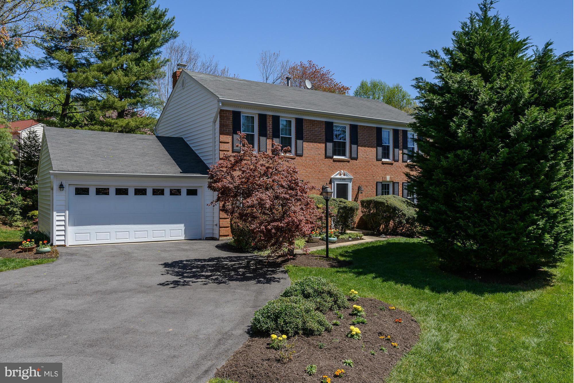 NEW PRICE!  Stylish & expanded col w fab gourmet kit! Great floor plan & great fam rm w fpl adj to renovated kit w custom cabnts, granite & stainless. Stunning sun rm addn + big laundry/mudrm. 4 BR/3.5 BAs, master w sitting rm, sunny W/O LL w big rec rm, guest rm & full BA. New windows&siding, cul-de-sac & great rear yard!