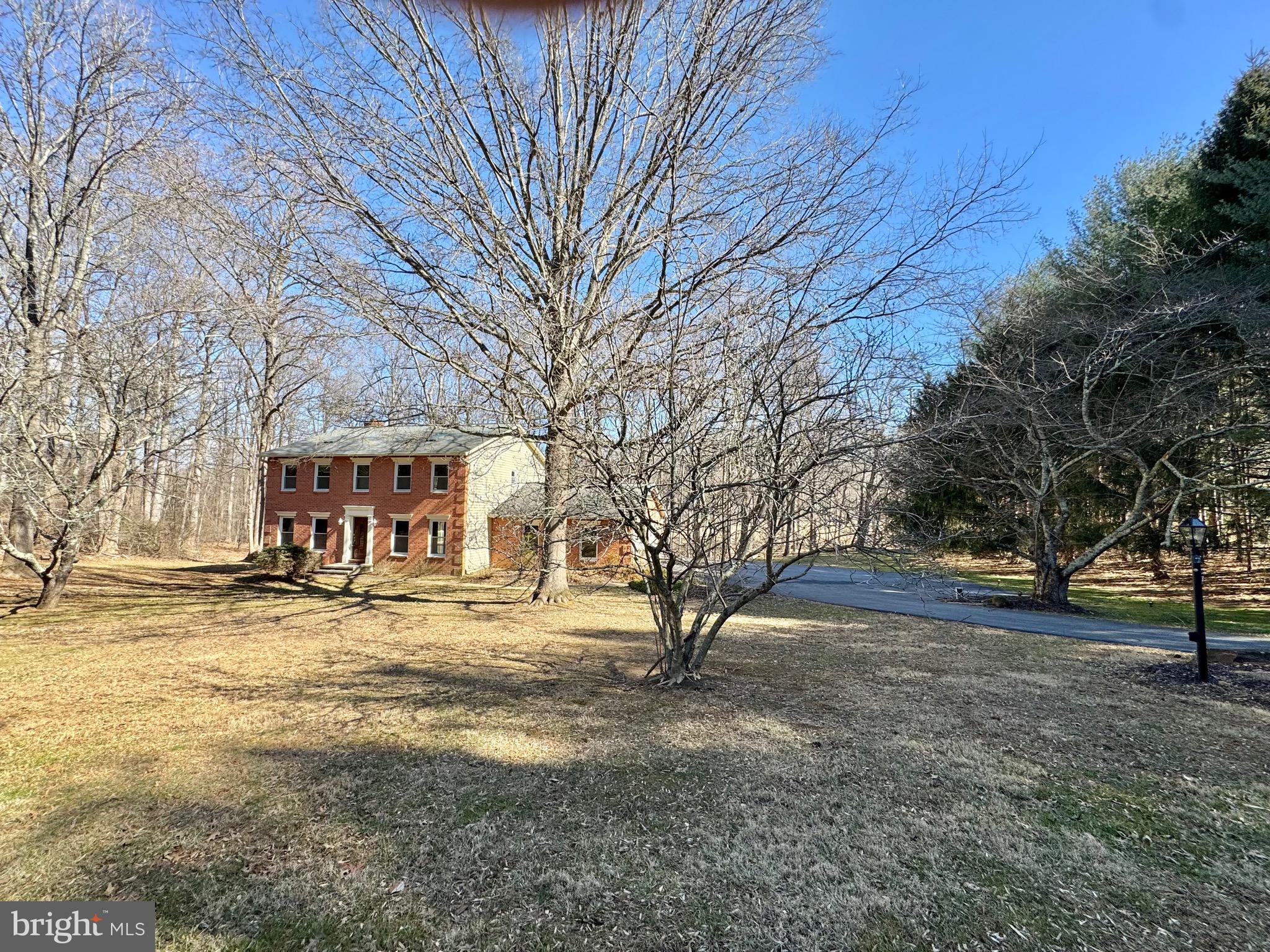 MUST SEE!  PRIVATE SUN-FILLED 4 BEDROOM 3.5 BATH CUSTOM BUILT BRICK COLONIAL HOME TOTALING 3,564 SQ FT SITTING ON 3 ACRE LOT! BUILT IN 1988.  FRESHLY PAINTED AND WOOD FLOORING THROUGHOUT ! MAIN LEVEL OFFERS UPDATED KITCHEN W/ SS APPLIANCES, ISLAND AND QUARTZ COUNTER TOPS.  BREAKFAST AREA OFF KITCHEN HAS SLIDER DOOR W/ ACCESS TO REAR DECK.  FAMILY ROOM HAS LIGHTED CEILING FAN, BRICK PROPANE GAS FIREPLACE, BRICK MANTEL AND BUILT-IN SHELVES.  SEPARATE DINING ROOM AND  LIVING ROOM HAS RECESSED LIGHTING! POWDER ROOM.  UPPER LEVEL PRIMARY EN-SUITE HAS SKYLIGHT, LIGHTED CEILING FAN AND ATTACHED UPDATED PRIMARY BATHROOM HAS TILED WALK-IN SHOWER!  3 ADDITIONAL SPACIOUS BEDROOMS W/ LIGHTED CEILING FANS AND SKYLIGHTS.  HALLWAY BATHROOM IS SPECTACULARLY UPDATED W/ TUB SHOWER!  LOWER LEVEL HAS RECREATIONAL ROOM AND BONUS ROOM, COULD BE GYM, OFFICE ETC...  LAUNDRY ROOM HAS WASHER/DRYER , UTILITY SINK, CEDAR SAUNA AND DOOR ACCESS TO REAR YARD! SUMP PUMP EXISTS HOWEVER NEVER HOOKED UP AS IS.  SELLER NEVER HAD ISSUE. EXTERIOR REAR HAS  LARGE COMPOSITE DECK THAT LOOKS OUT TO BREATHTAKING WOODED VIEW! PRIVATE DRIVEWAY. ROOF 2013 CLOSE TO SHOPS, RESTAURANTS!