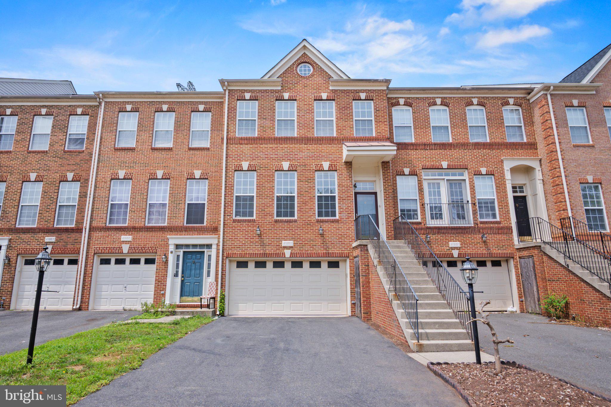 Welcome to this stunning, rarely available townhome in the heart of Stone Ridge! Thoughtfully extended across all three levels, this exceptional home offers 4 bedrooms, 3 full bathrooms, 1 half bathroom, and a 2-car garage — with the space, style, and finishes today's buyers are looking for.

The main level is made for both everyday living and effortless entertaining. A sun-drenched living room flows seamlessly into a formal dining area, leading into a beautifully renovated gourmet kitchen. The adjacent family room features rich hardwood flooring and opens to a charming sunroom — perfect for morning coffee — and a private deck backing to trees, ideal for outdoor dining and relaxing in nature.

Upstairs, the spacious owner's suite is a true retreat, complete with two walk-in closets, a generous sitting room, and a spa-inspired en suite bath featuring dual sinks, a soaking tub, and a frameless glass shower. Two additional bedrooms and a full bathroom complete the upper level.

The finished walkout lower level offers incredible versatility with a large recreation room, fireplace, a private bedroom, and full bathroom — all with its own separate entrance.

Beyond the front door, Stone Ridge living awaits: over 5 miles of scenic trails, two swimming pools, tennis and basketball courts, and beautiful Byrne Ridge County Park. Everyday conveniences — Harris Teeter, Costco, Giant, restaurants, and more — are minutes away, with easy access to Dulles Airport and major commuter routes including Rt. 50, Rt. 28, and Rt. 66.

This one truly has it all. Welcome home!