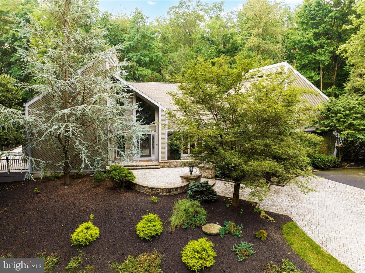 Stunning in Sinking Spring!   Enjoy this spectacular home secluded on 6.32 acres in a private estate setting.   This home has been impeccably remodeled and artfully placed to take full advantage of the amazing atmosphere.  Awe-inspiring contemporary architecture, custom inground pool, putting green, koi pond and extra large outbuildings.  Too  many amenities to describe.    Magnificent and expansive kitchen features modern appliances and upgraded custom granite countertops.   Oversized windows galore allow you to enjoy the beautiful highlights of nature while at the same time providing a sanctuary from the hustle and bustle of life.     Just imagine living life to its fullest jumping in the pool and cooking on the grill on the large covered terrace after a long day at work.   Or, relax in the steam shower.  And, no need to worry about tracking wet feet in the house since your guests can change in the cabana out-building next to the pool.     There is also a lap pool and exercise room with rubber flooring in the basement with a separate exit/entrance to the attached 3 car garage.    A whole house generator will help keep you warm in the winter if the power goes out.     The auto enthusiast will be living the dream in the 9 car garage and additional pole barn, both have high ceilings and own heating system.   These garage outbuildings are amazing!   With two primary suites, you could use one as a guest or inlaw suite.   Must see.  Home Warranty Included with acceptable Agreement of Sale.   Owner is a licensed PA Realtor.