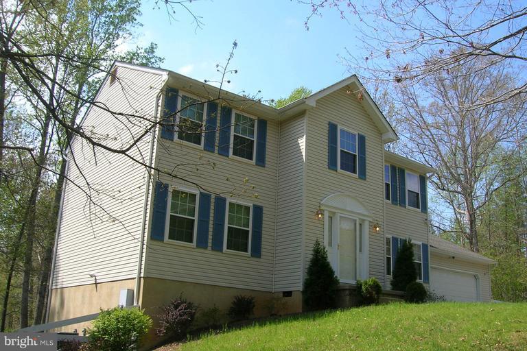 New, New, New. Fresh paint, new SS appliances, new double hung vinyl TRIPLE pane GAS filled windows installed 2012, new front door 2012,new garage door 2011, new gutters with leaf Guard system 2011, fascia and soffits encapsulated 2012, zoned heat pumps with propane gas furnace back up with auto switch over 2012, new roof shingles 2014. Enjoy the great deck and patio with fire pit. Hardwood floors