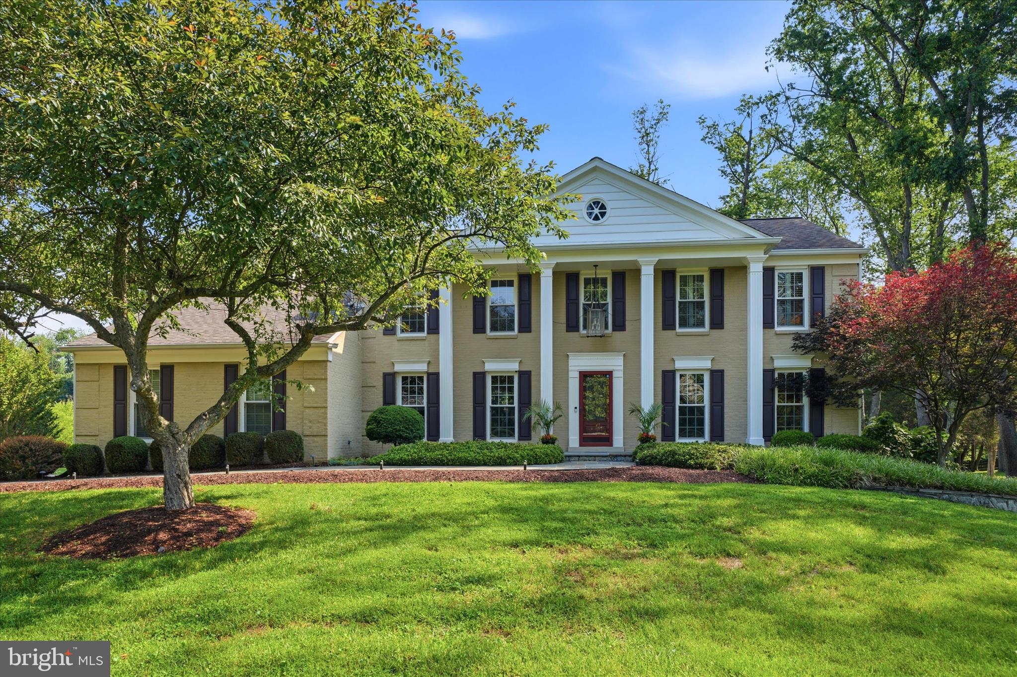 Welcome to 15113 Water Oak Court, a beautifully maintained estate set on over two private acres in the coveted Ancient Oak community of North Potomac. Tucked at the end of a quiet cul-de-sac with scenic wooded views and no HOA, this five-bedroom, move-in ready home offers a rare combination of space, privacy, and everyday convenience — recently redistricted to the Poolesville cluster beginning Fall 2027 (buyers should independently verify current and future school assignments).
The main level features hardwood floors throughout, a spacious foyer, formal living and dining rooms, a private office, powder room, and a generous family room anchored by a wood-burning fireplace. The gourmet kitchen is appointed with granite countertops, a center island, Brookhaven cabinetry, a large pantry, Thermador dual-fuel range, and Jenn-Air dishwasher and refrigerator. A large mudroom/laundry room connects directly to the garage.
Upstairs, four bedrooms include a primary suite with a custom walk-in closet, skylight, and a fully renovated bath featuring heated floors, Perrin & Rowe fixtures, double vanity, soaking tub, and thermostatic shower. The fully finished walkout lower level adds a fifth bedroom, wet bar, surround sound, and a large recreation area — ideal for guests, multigenerational living, or entertaining.
Outdoors, enjoy a two-level deck, flagstone patio with fire pit, covered front porch, and a sweeping private yard backing to trees. Additional details include crown molding throughout, recessed lighting, and an updated septic system.
Minutes to Kentlands, Downtown Crown, Shady Grove Metro, MARC train, I-270, and the ICC — with easy reach to Frederick and Washington, D.C.