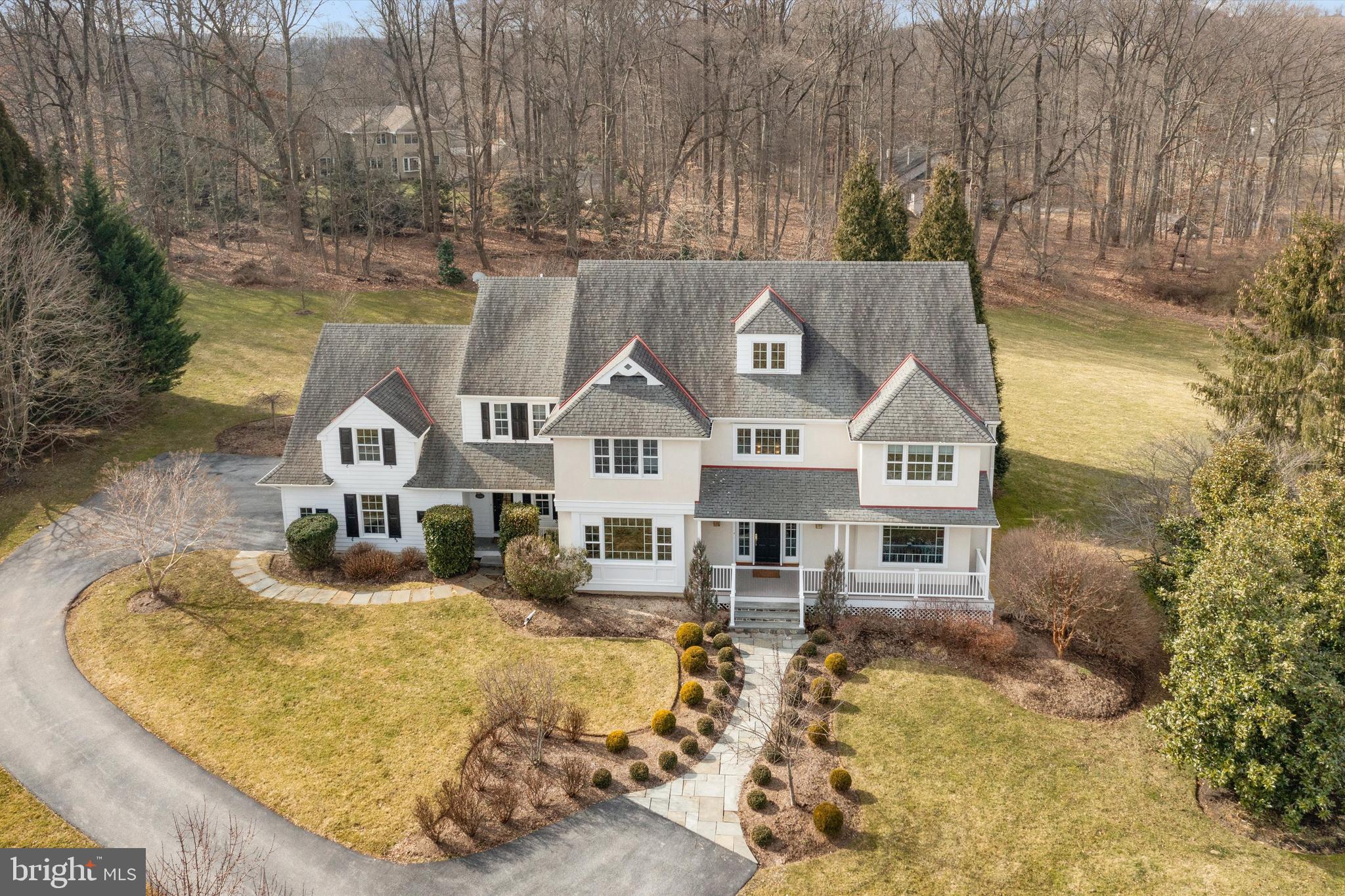 Located in a tranquil setting at the end of a cul de sac in the heart of Chester Springs, you will find this custom-built home by John Diament in the award-winning Downingtown East School District and highly rated STEM Academy. This premium lot provides over 1 acre with lush grounds and an expansive backyard that is surrounded by mature trees and well-manicured landscaping.  The beautiful blue stone patio is the perfect spot for entertaining guests or relaxing at the end of a long day.   

Upon entering the home, you’ll notice amazing natural light and attention to detail with custom millwork and arched doorways. The top to bottom wall paneling and wainscoting in the 2-story foyer and  beautiful staircase immediately grab your eye.  The foyer is flanked by a gracious living room and a lovely formal dining room. The floor plan flows seamlessly with hardwood floors throughout. The updated gourmet kitchen is magazine worthy with beautiful cabinetry, quartz countertops and an elegant, tiled backsplash, a spacious island, gorgeous lighting fixtures, a walk-in pantry, stainless appliances include a Sub-Zero refrigerator/freezer, Wolf double-oven with 6-burner range with griddle and a custom hood vent.  Enjoy scenic views of the backyard from the oversized window above the farmhouse sink. There is also a coffee bar and wet bar located between the kitchen and dining room. The breakfast room provides access to the patio, which offers great flow when entertaining. Continue into the stunning yet cozy family room with cathedral ceiling, a handsome stone, wood-burning fireplace surrounded by custom paneling and built-ins. 

The first floor also provides a spacious study with a window seat and built-ins, a powder room with wood paneled walls, a laundry/mudroom and a drop-zone with access to the 3-car garage.

The second level offers 4 spacious bedrooms, a bonus room that could set up as a 5th bedroom and 3 full bathrooms. The primary bedroom suite includes a tray ceiling, a lovely sitting area and an exquisitely updated bathroom with a slipper tub, two separate vanities, an oversized walk-in shower with floor to ceiling subway tile and two walk-in closets. 

The 4 additional rooms on this level are all spacious and 2 of the bedrooms share a jack and jill bathroom with a double vanity and tiled tub-shower combination. The 2 additional rooms have access to a hallway bathroom. The wing opposite of the primary bedroom suite is currently set up as a den and can be set up as a 5th bedroom, media room, playroom, hobby/craft room, additional home office, etc. There is a staircase to the 3rd level which is completely floored with dormered windows that provide wonderful natural light. This level is currently used for storage and has great potential for additional future finished living space. 

There is a secondary, back staircase that provides access from the second floor to the first floor kitchen area. 

The lower level of the home provides additional unfinished space with high ceilings and walk-out access as well as roughed-in plumbing for a future bathroom. There are endless possibilities with this space!  Incredible location with easy access to major routes: 113, 30, 202 and the PA Turnpike.  Enjoy many wonderful nearby options for shopping, dining, parks and more!