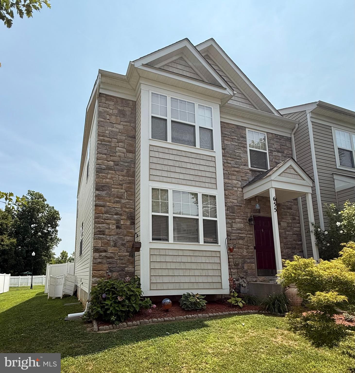 PROFESSIONAL PHOTOS COMING WEDNESDAY 7/22/26.  Welcome home to this exceptional end-unit townhome in the highly desirable Oak Tree Landing community! Boasting over 2,900 square feet of finished living space with bump-outs on all three levels, this is one of the largest floor plans in the neighborhood. A brand-new roof installed in 2024 with a transferable 10-year warranty offers lasting peace of mind, while recently cleaned carpets make this home truly move-in ready.

The bright, open main level showcases stylish luxury vinyl plank flooring, an expansive living room with a cozy fireplace, and a beautifully appointed gourmet kitchen featuring granite countertops, a center island, stainless steel appliances, tile backsplash, a pantry, and abundant cabinet space. The adjoining dining area and sun-filled morning room create the perfect space for everyday living and effortless entertaining, while a convenient powder room completes the main level.

Step outside to the fully fenced backyard where a recently stained deck and a shade sail provide the ideal comfortable setting for relaxing, grilling, or hosting family and friends.

Upstairs, the spacious primary suite offers a peaceful retreat with a vaulted ceiling, two generously sized walk-in closets, and a luxurious en-suite bath complete with a corner soaking tub, separate tiled shower, and dual-sink vanity. Two additional bedrooms and a full bathroom complete the upper level.

The fully finished basement offers incredible versatility with a spacious recreation room, a convenient kitchenette featuring a built-in wet bar and wine refrigerator, a private den or home office that could easily serve as a fourth bedroom, a full bathroom, and a laundry room. Whether you're hosting overnight guests, creating the perfect entertainment space, or working from home, this level adapts to your lifestyle.

Ideally located just minutes from Prince Frederick Town Center, you'll enjoy convenient access to community walking paths and a tot lot, as well as shopping, restaurants, entertainment, CalvertHealth Medical Center, Route 4, and a nearby commuter park-and-ride. Combining generous living space, thoughtful updates, and an unbeatable location, this move-in-ready home truly has it all!