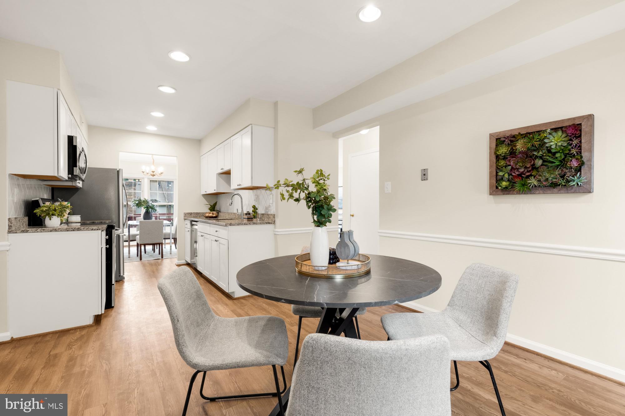END UNIT - Special home w/an open lay-out, light-filled rooms, great location & no condo fees! Great flow - see the floor plans & the video too!  Sun-filled and oh so spacious! Pretty END unit w/Brick Front & a neutral palate offering: 3 BRS, 2 full BAs, 2 Half BAs, Large Recreation Rm on Lower-Level w/walk out, expansive Deck w/stairs to paver Patio, Laminate Flooring on Main & Lower levels, plush carpeting on BR level, Inviting Breakfast area, Updated Kitchen w/SS appliances, stunning Granite counters, attractive backsplash &  ample cabinetry. Don’t’ miss the generous Laundry Rm w/lots of storage areas. A welcoming Foyer greets you as your tour begins - starting w/the convenient Powder Rm; very functional & updated Kitchen w/recessed lighting & SS sink; Kit has a delightful breakfast area too!  Then, access to the Kitchen from Foyer & also from the separate Dining Rm; enjoy entertaining in the oversized Living Rm w/recessed lighting, plus access to the Deck from Slider. Upper level includes 3 BRs all w/ceiling fans: Primary spacious BR & Primary BA w/shower & walk-in closet; Hall BA w/tub; 2 additional BRs. Lower-Level w/Full daylight Rec Rm, fireplace & level walk out to yard. Convenient 2nd Half BA & spacious LA area off from the Rec Rm. This exceptional home w/generous size rooms offers many updates: NEW ROOF (by Seneca) – 2/2021; Furnace & A/C – 4/2023; SS Fridge/Freezer, Dishwasher, Stove/Oven - 2023; Humidifier - 2023; Main Level Flooring - 2023; Laminate Lower-Level Flooring w/additional waterproofing backing – 6/2025; Ceiling Fan in Rear BR - 7/2025. All this in a sought-after community that is tucked away w/sidewalks & mature trees, yet mins to shopping, dining, parks, theaters, DC, VA, Bethesda, White Flint METRO & bus line. See & be part of the vibrant Pike & Rose location & also enjoy the new nearby Wegmans! What a special home & location. Check out the floor plans and the video too. NO CONDO FEES! 
HOA Fee -covers trash, recycle & common area maint. PICS ONLINE SHOW HOW THE HOME WOULD LOOK WITH FURNTURE.  No longer professionally staged.