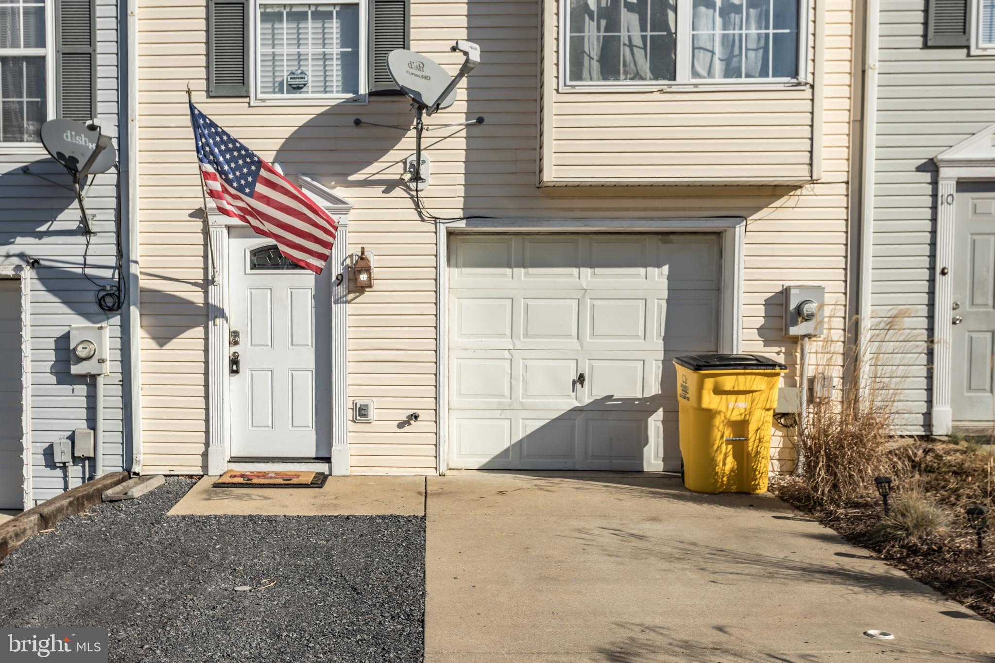 Beautiful three story townhome in Hedgesville Hills and NO HOA fees!  Excellent starter home and buy for much less than you can rent.  Two oversized bedrooms and full bath are on the third level.  Main level features a kitchen/dining combo and all appliances convey.  Main level also has a half bath and a family room that walks out to a fenced patio. New LVP flooring in the downstairs and in the full bath.  Separate large laundry room has washer and dryer that also convey.  Seller to leave wired security cameras for the new owner.  Plenty of parking in the large one care garage and two additional driveway spots.  Close to commuter routes and move in ready!