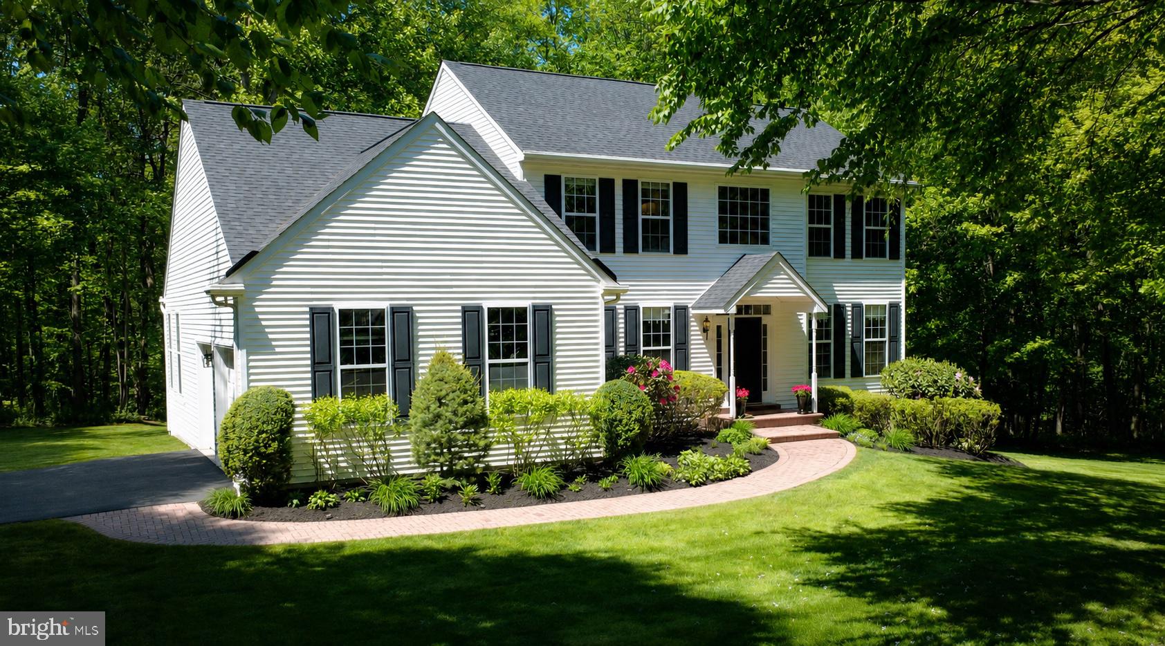 Welcome to 25 Dougherty Drive, a beautifully maintained 4-bedroom, 2 full and 2 half-bath Colonial tucked at the end of a quiet cul-de-sac on 1.64 private acres in the sought-after Coventry Greene community of Lincoln University. Backing to mature woodlands and the trails of Elk Creek State Park, this exceptional home offers more than 3,300 square feet of living space and the rare combination of privacy, quality craftsmanship, and true turnkey condition including a brand-new roof and full septic system installed in Spring 2026.

A dramatic two-story foyer with gleaming hardwood floors and a sweeping double staircase creates an impressive first impression. The soaring vaulted family room with gas fireplace flows seamlessly into the renovated kitchen featuring custom maple cabinetry, granite countertops, stainless steel appliances, and a large center island designed for gathering and entertaining.

The primary suite offers a true retreat, complete with a custom walk-in closet and a beautifully renovated spa-inspired bath featuring a freestanding glass-enclosed shower, dual vanity, vaulted ceiling, and a jetted soaking tub. Three additional bedrooms, a renovated hall bath and laundry room (2020), plus flexible office/ bonus spaces on the main level provide ideal versatility for today’s work-from-home lifestyle.

The finished lower level is an extension of the home itself, thoughtfully designed with a gas-fireplace lounge, library, cozy nook, fully equipped gym, wet bar with full-size refrigerator, half bath, additional study/bonus room, and ample storage.

Outdoor living is equally impressive. A sprawling AZEK composite deck overlooks a backyard designed for both relaxation and recreation. At the center is an Endless Pool with automatic cover (2021), offering a premium swim and exercise experience year-round, complemented by a Caldera hot tub for every season. A screened porch extends outdoor enjoyment even further, while a campfire pit, enclosed SpringFree trampoline (2020), and mature landscaping create a setting that feels more like a private retreat than a suburban backyard.

Additional features include a 2-car garage, easily-accessed attic storage, an exterior storage shed, whole-house water treatment system with neutralizer and softener, 80-gallon water heater, well pump, hybrid heat pump/propane HVAC system, and radon mitigation system.

Ideally located within the Oxford Area School District, this home is within easy reach of Newark, Jennersville, Kennett Square, and Wilmington, and an hour’s commute to Philadelphia, Baltimore, and area airports. Residents enjoy a walkable, family-friendly neighborhood with a scenic 3-mile loop and nearby access to Old Stone Cider for local events and evenings out.

Move-in ready and meticulously cared for, the property also offers a furniture package available for separate purchase and includes a pre-listing home inspection report completed in March 2026 for added buyer confidence.