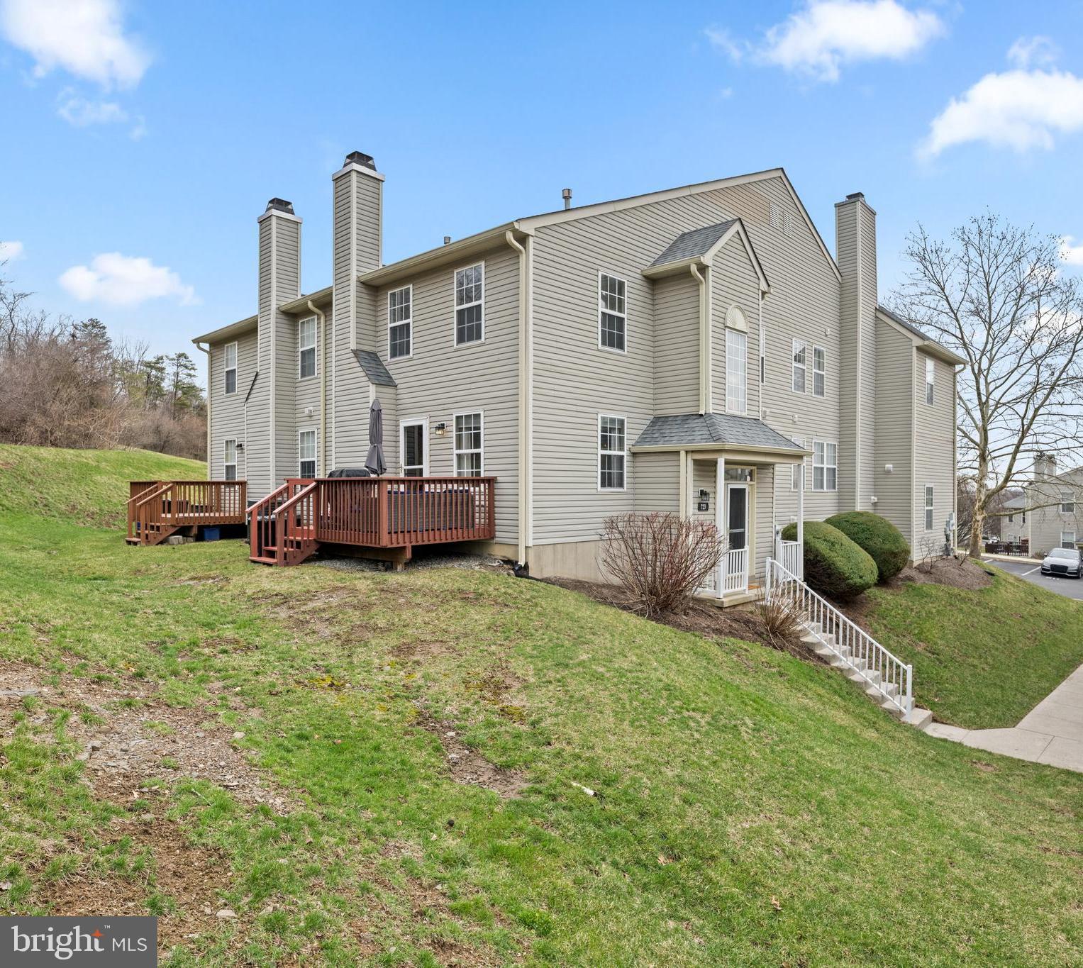 Welcome to a warm, inviting, spacious, and well-maintained bi-level end condo with a traditional house feel! This low maintenance condo is in the popular Providence View community that has great amenities.  Step into the inviting foyer that leads to the upstairs spacious living room with gas fireplace and access to a deck that features a private yard. Then walk on beautiful hardwood floors that leads to an open dining room and updated eat in kitchen. There is a large pantry, laundry room, and updated powder room as well.  The second level offers a  spacious primary suite with a walk in closet and modern full bathroom, two additional bedrooms, and a hall bathroom.  The carpeted finished basement offers lots of privacy and is sectioned with a family room, office, and great storage. The  community offers luxury,  with a fitness center, swimming pool, tennis courts, and playground.  The community is near the Providence Town Center and major highways like PA-29 and US-422. This condo and community offer lots of charm and can be your next home! The Seller will provide a HOME WARRANTY.