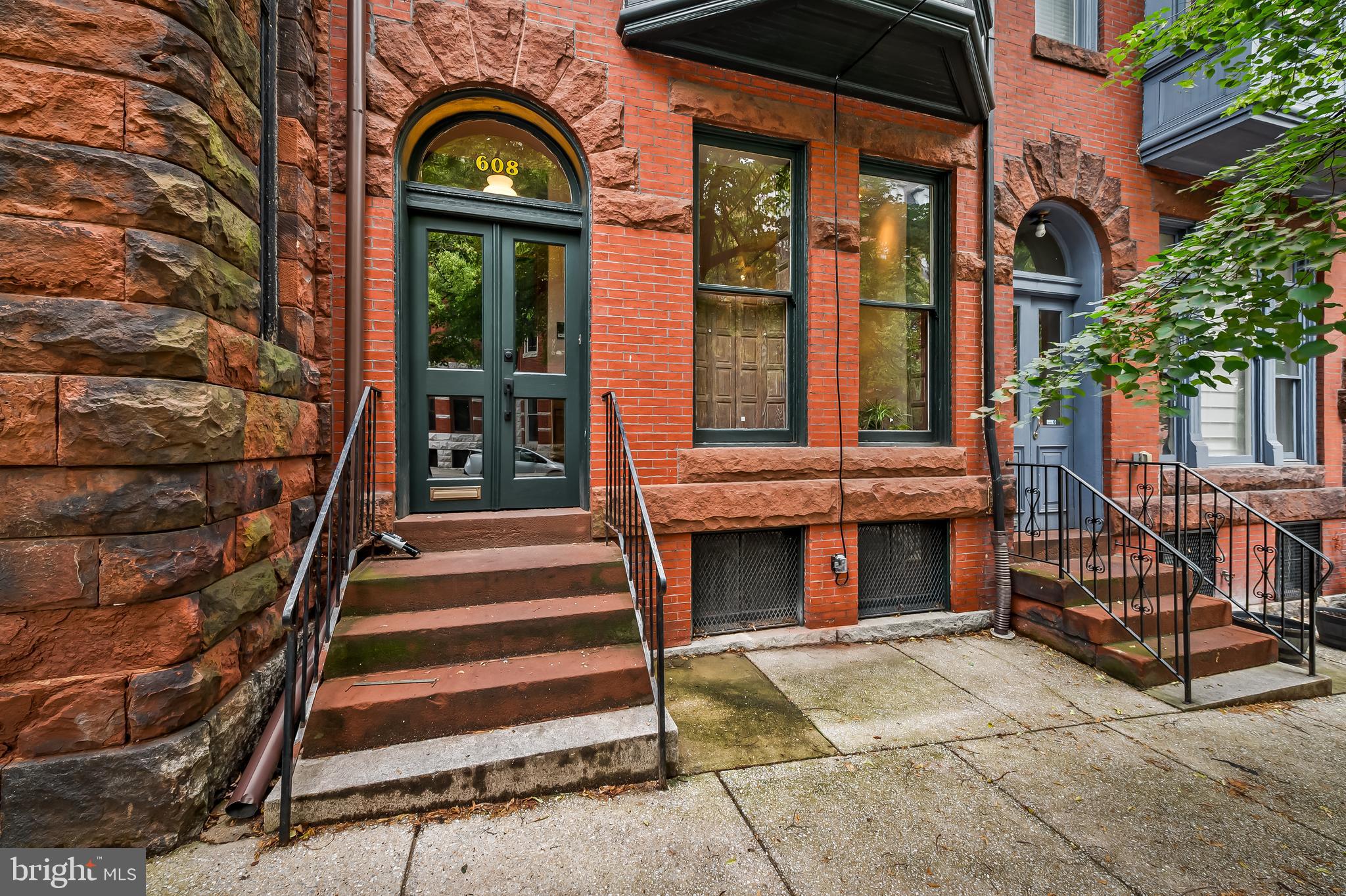 You know what you are looking for. You have lived in Brooklyn, Capitol Hill, Fishtown, or perhaps grew up in a house with real history and character. You care about original details, authentic neighborhoods, and neighbors who actually know your name. You are done with the flips, gray paint, and vinyl flooring. You want the real thing.

Tucked on a quiet, tree-lined corner in the coveted Mount Royal Terrace section of Reservoir Hill, this Victorian has been thoughtfully restored and deeply loved. Home to writers, artists, academics, and creative thinkers for generations, it was once the residence of Carleton Jones, beloved Sunday Sun columnist and author of Streetwise Baltimore. The creative and intellectual spirit of Baltimore is woven into the fabric of this home.

Inside, heart pine floors, majestic original windows, three remarkable mantels with original tilework, and preserved period details speak to a level of craftsmanship rarely found today. Every generation of ownership has improved the home while respecting its history.

The main level features a gracious living room anchored by an original mantel, a formal dining room, convenient powder room, and a thoughtfully designed kitchen with generous cabinetry, ample prep space, and the original brick kitchen hearth still intact. Just beyond, a private rear deck overlooks a charming pocket park, offering a peaceful green view in the middle of the city.

The second floor offers three flexible bedrooms and a recently updated full bath. Whether you need guest rooms, offices, creative space, or room to grow, the floor plan adapts beautifully to modern living.

Occupying the entire third floor, the owner's suite provides a private retreat with a refreshed vintage bath and separate dressing room, office, or studio. Light filled and quiet, it is the perfect place to work, read, create, or simply unwind.

Recent improvements include a refreshed and certified flat roof (2026), rebuilt slate mansard roof (2022), custom Maryland Historic Trust-approved third-floor windows with copper flashing, full exterior repainting in historic Rookwood Shutter Green, restoration of the rear sleeping porch and front bay window, new hot water heater, fresh paint, refinished floors, central air conditioning, and beautiful stained glass throughout.

Reservoir Hill, and Mount Royal Terrace in particular, remains one of Baltimore's most authentic historic neighborhoods. Neighbors know one another. Residents put down roots. The architecture is extraordinary, and institutions such as Johns Hopkins, MICA, the University of Maryland, and the cultural destinations of North Charles Street are part of everyday life.

For commuters, Penn Station, MARC, Amtrak, Light Rail, bike lanes, and I-83 are all minutes away, making travel to Washington, Philadelphia, and New York remarkably convenient. Druid Hill Park, the Baltimore Museum of Art, Station North, and some of the city's best restaurants, cafés, and cultural institutions are all within easy reach.

This is not a reproduction of a historic home. It is a historic home. Authentic, beautifully maintained, and ready for its next chapter. If you have been searching for a home with character, substance, history, and soul, you may have just found it.