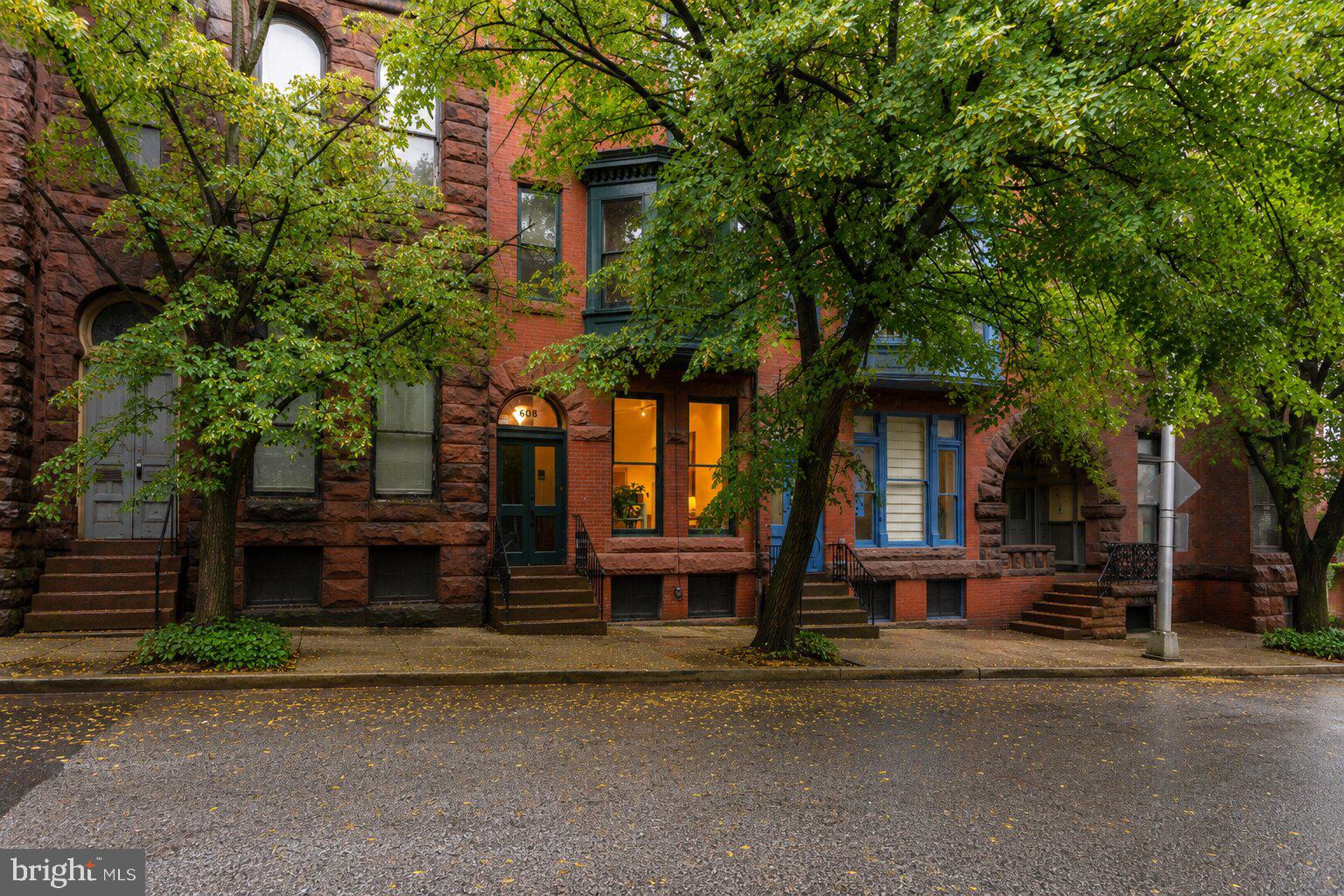 You know what you are looking for. You have lived in Brooklyn, Capitol Hill, Fishtown, or perhaps grew up in a house with real history and character. You care about original details, authentic neighborhoods, and neighbors who actually know your name. You are done with the flips, gray paint, and vinyl flooring. You want the real thing.

Tucked on a quiet, tree-lined corner in the coveted Mount Royal Terrace section of Reservoir Hill, this Victorian has been thoughtfully restored and deeply loved. Home to writers, artists, academics, and creative thinkers for generations, it was once the residence of Carleton Jones, beloved Sunday Sun columnist and author of Streetwise Baltimore. The creative and intellectual spirit of Baltimore is woven into the fabric of this home.

Inside, heart pine floors, majestic original windows, three remarkable mantels with original tilework, and preserved period details speak to a level of craftsmanship rarely found today. Every generation of ownership has improved the home while respecting its history.

The main level features a gracious living room anchored by an original mantel, a formal dining room, convenient powder room, and a thoughtfully designed kitchen with generous cabinetry, ample prep space, and the original brick kitchen hearth still intact. Just beyond, a private rear deck overlooks a charming pocket park, offering a peaceful green view in the middle of the city.

The second floor offers three flexible bedrooms and a recently updated full bath. Whether you need guest rooms, offices, creative space, or room to grow, the floor plan adapts beautifully to modern living.

Occupying the entire third floor, the owner's suite provides a private retreat with a refreshed vintage bath and separate dressing room, office, or studio. Light filled and quiet, it is the perfect place to work, read, create, or simply unwind.

Recent improvements include a refreshed and certified flat roof (2026), rebuilt slate mansard roof (2022), custom Maryland Historic Trust-approved third-floor windows with copper flashing, full exterior repainting in historic Rookwood Shutter Green, restoration of the rear sleeping porch and front bay window, new hot water heater, fresh paint, refinished floors, central air conditioning, and beautiful stained glass throughout.

Reservoir Hill, and Mount Royal Terrace in particular, remains one of Baltimore's most authentic historic neighborhoods. Neighbors know one another. Residents put down roots. The architecture is extraordinary, and institutions such as Johns Hopkins, MICA, the University of Maryland, and the cultural destinations of North Charles Street are part of everyday life.

For commuters, Penn Station, MARC, Amtrak, Light Rail, bike lanes, and I-83 are all minutes away, making travel to Washington, Philadelphia, and New York remarkably convenient. Druid Hill Park, the Baltimore Museum of Art, Station North, and some of the city's best restaurants, cafés, and cultural institutions are all within easy reach.

This is not a reproduction of a historic home. It is a historic home. Authentic, beautifully maintained, and ready for its next chapter. If you have been searching for a home with character, substance, history, and soul, you may have just found it.