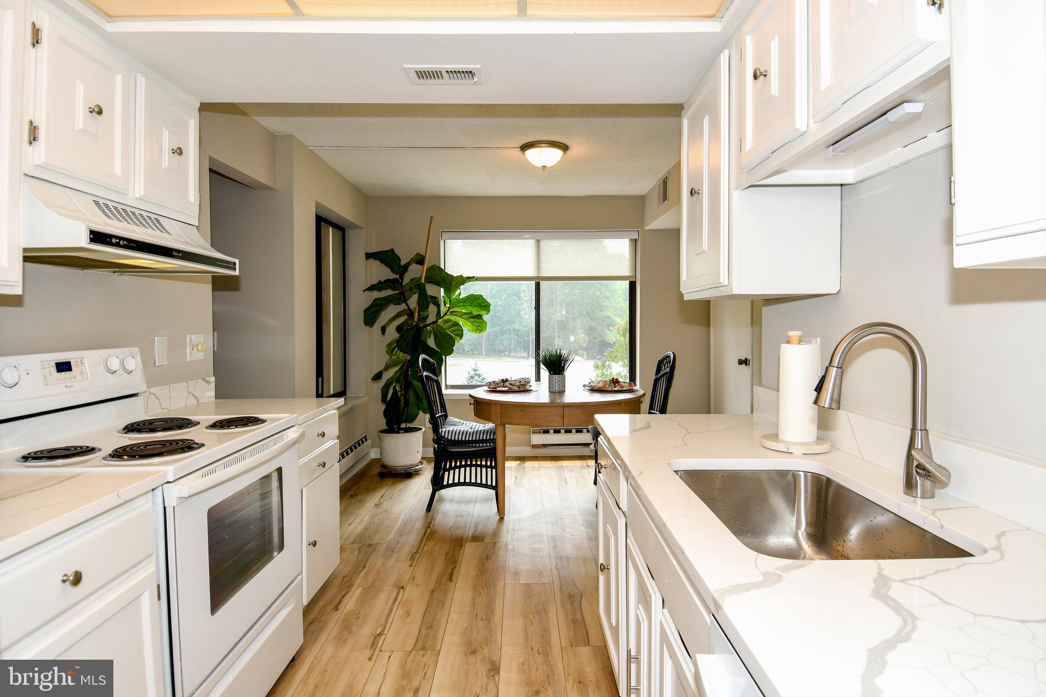 Welcome to this beautifully updated 3-bedroom, 2-bath condominium in the highly sought-after 55+ community of Leisure World! This move-in-ready home offers the perfect blend of comfort, style, and low-maintenance living. Inside, you'll find a freshly painted interior (June 2026), new white quartz kitchen countertops (June 2026), laminate kitchen flooring (2024), new carpet (November 2025), and updated kitchen appliances, including a refrigerator (2025), microwave (2025), and dishwasher (2024). The spacious owner's suite features a beautifully remodeled ceramic tile shower (2022), while both bathrooms have been refreshed with updated vanities, mirrors, and light fixtures. Additional updates include a new hot water heater (June 2026), painted laundry room cabinets with new hardware (June 2026), and an A/C fan motor replacement (2024). There is a screened enclosed balcony, approximately 12 feet long by 4 feet deep, perfect for a bistro table where you can enjoy a good book or your morning coffee. This sun-filled, move-in-ready condo allowing you to settle in and start enjoying the Leisure World lifestyle from day one. The building offers elevator access, one assigned parking space, and a secure, climate-controlled storage unit measuring approximately 4' x 4' x 8'. Leisure World offers an exceptional lifestyle with three gated entrances, two clubhouses, indoor and outdoor pools, fitness center, an 18-hole golf course, tennis and pickleball courts, restaurants, walking paths, 24-hour security, and a community bus service to neighborhood amenities and local shopping. Don't miss this opportunity to enjoy resort-style living in one of Montgomery County's premier active adult communities!
