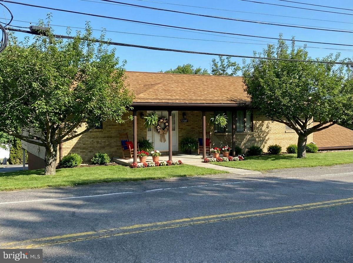 Check out this charming three-bedroom, three-bathroom ranch, with thoughtful single-level living and a finished lower level. There are two bedrooms and two full baths on the main level, including a primary suite with walk-in closet and en-suite bath, equipped with grab bars for added safety. A main-level laundry adds convenience. Bright, open kitchen and dining area are centered around a large island that is perfect for meal prep and casual gatherings. The living room stretches across the front of the home, offering abundant natural light and easy flow to the rest of the main floor. The lower level features a spacious recreation room and a third bedroom and bath, with walk-out access to the three-bay garage. Enjoy outdoor living on the rear lower level patio or main level deck, which is ideal for morning coffee or evening relaxation. Be prepared for power outages with a whole-house generator. This property has so much to offer. Call Today to Schedule a Tour!!!  *** Some images are AI-generated/virtually staged for illustration purposes only. Please tour the property in person to verify actual condition.