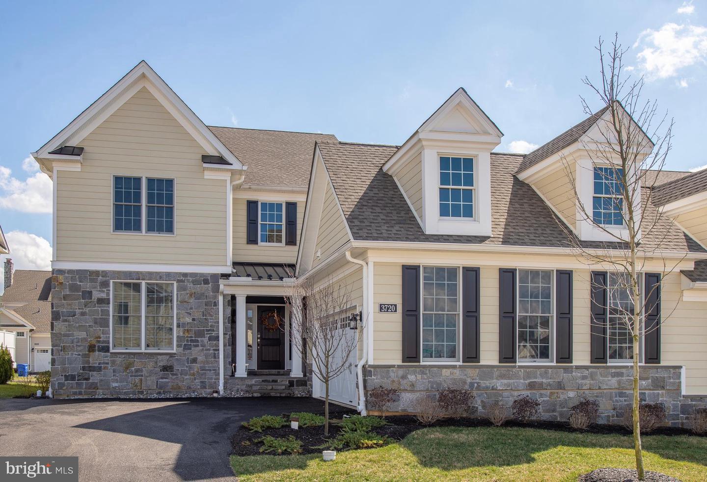 Welcome to this beautifully appointed 4 bedroom home in the highly sought-after St. Davids Collection within the Liseter community offering the perfect blend of luxury, comfort, and convenience in a truly move-in ready home. Designed with an open and airy layout, this Rosemont Farmhouse model showcases gleaming hardwood floors, abundant natural light, and impressive two-story spaces throughout the foyer and family room. The main-level primary suite is a standout feature, complete with soaring ceilings, a spacious bedroom, spa-inspired en-suite bath, and a generous walk-in closet providing the ease of first floor living.  At the heart of the home, the gourmet kitchen is built for both everyday living and entertaining, featuring granite countertops, stainless steel appliances, and an oversized island with seating. The expanded breakfast area flows seamlessly to a large deck ideal for outdoor dining or relaxing.
The dramatic two-story family room is highlighted by a striking stone fireplace, creating a warm and inviting gathering space. The main level also includes a private study with French doors, a formal dining room, powder room, mudroom, and laundry room.  Upstairs, you’ll find three additional well-sized bedrooms and a full hall bath, offering flexible space for family, guests, or a home office setup. The unfinished basement provides endless potential to customize—whether you envision a home gym, media room, or additional living space. Residents of Liseter enjoy exceptional amenities, including a clubhouse with fitness center, infinity pool, tennis courts, scenic walking trails, and the charming Carriage Barn—perfect for social events and community gatherings.

Ideally located just minutes from downtown Wayne, Newtown Square Town Center, and the Paoli train line, this home offers easy access to Center City Philadelphia and the airport—making it as convenient as it is beautiful.