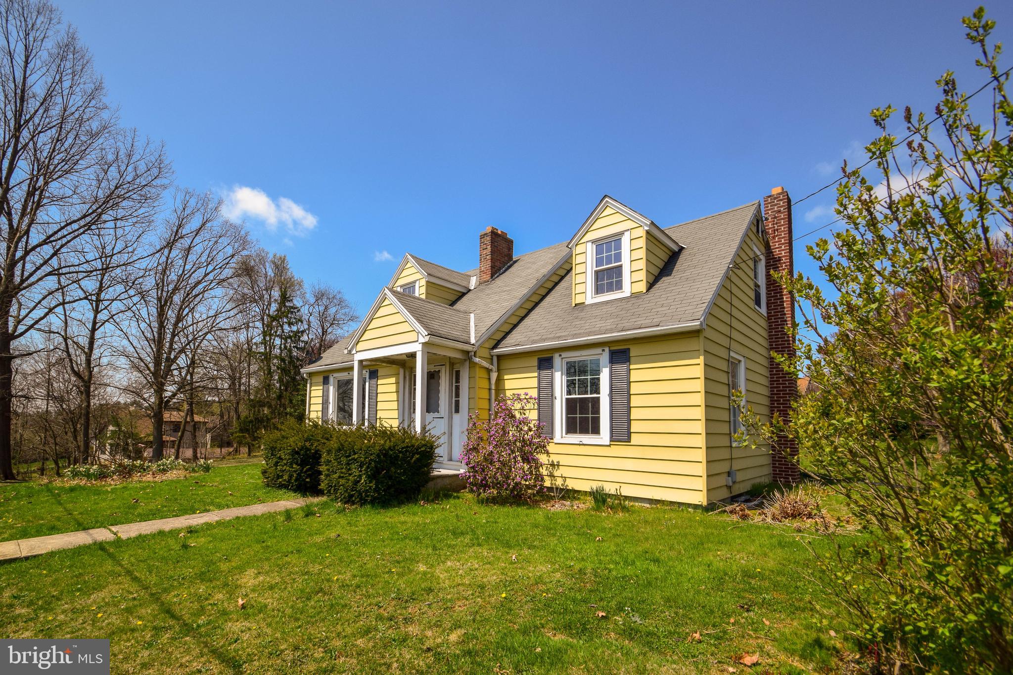 This 3-4 BR, 2-1/2 bath home is larger than it appears!  Freshly painted and carpeted on the first floor and lower levels, it is move-in ready!  The home offers a huge eat-in kitchen with island, formal living room with fireplace, finished lower level with gas stove and kitchenette .  Property consists of two separate lots being sold together, which offers possibilities for expansion.  Conveniently located close to major arteries, schools and shopping and ready for its new owner.