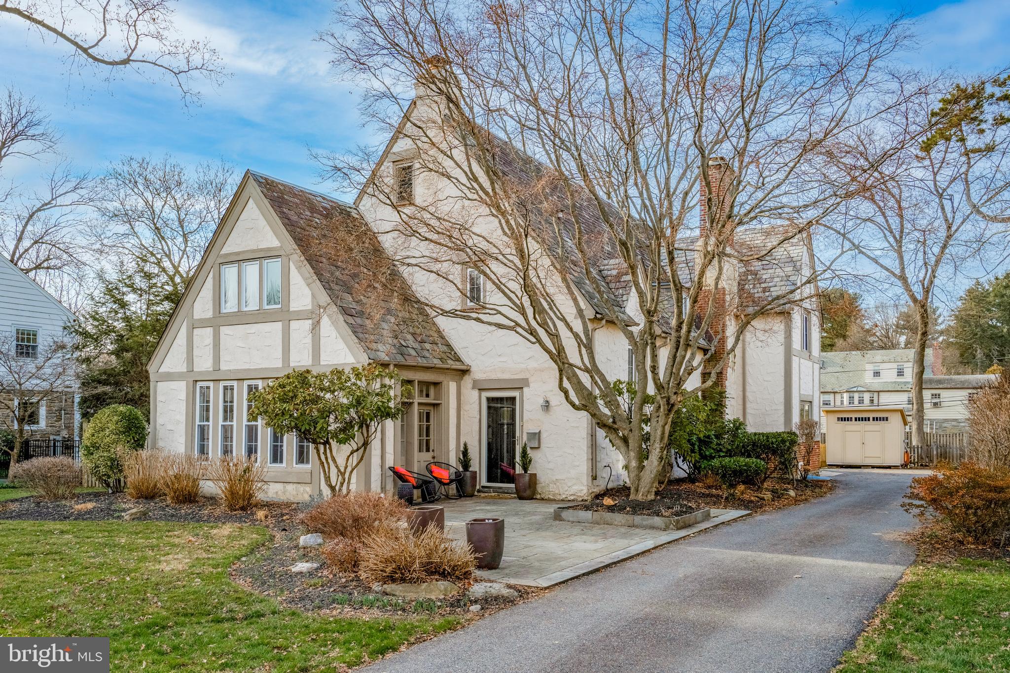 Welcome to 3500 SF of comfortable luxury living in the heart of Lower Merion Township!  This Tudor style home has been beautifully updated and meticulously maintained offering 4 bedrooms and 2.5 baths and situated on one of the most desirable streets in Wynnewood.  This stunning property has a completely renovated main level with gourmet kitchen featuring a wet bar with wine fridge, handsome cabinets completed with leathered granite top.  Gourmet kitchen features marble countertop island, custom backsplash, 6-burner Thermador stove, stainless double oven and high end appliances, 42” cabinetry surrounds the kitchen with additional storage in Kitchen Island, custom built in office area, mudroom and more.  Kitchen opens to a large formal living room centered by a wood burning fireplace, access to an oversized  1 and half car garage (currently being used as home gym) along with French doors leading to a completely fenced in backyard with slate patio – perfect for entertaining.  Main level also features a powder room, inviting entry hall with large coat closet, sunroom/den/playroom off formal living room and amazing natural light throughout accenting the beautiful hardwood floors.  The charm combined with modern amenities of this home provide unique character  - arched doorways, slate roof, beautiful wood staircase with 2 story ceiling.  Second level provides a large main suite with separate dressing/sitting area or another home office space, his/her closets and updated double sink primary bath.  Three additional large bedrooms – two with Jack and Jill full bath, spacious Laundry room, linen closet and abundant closet space throughout.  Basement is unfinished and provides lots of storage and can be easily finished to the buyer's needs. Perfectly situated in the highly ranked Lower Merion school district, and just minutes from Wholefoods, Wynnewood shopping center & Main Line premier restaurants, Wynnewood Train Station, major highways and public transportation. You won’t want to miss out on this truly remarkable home.