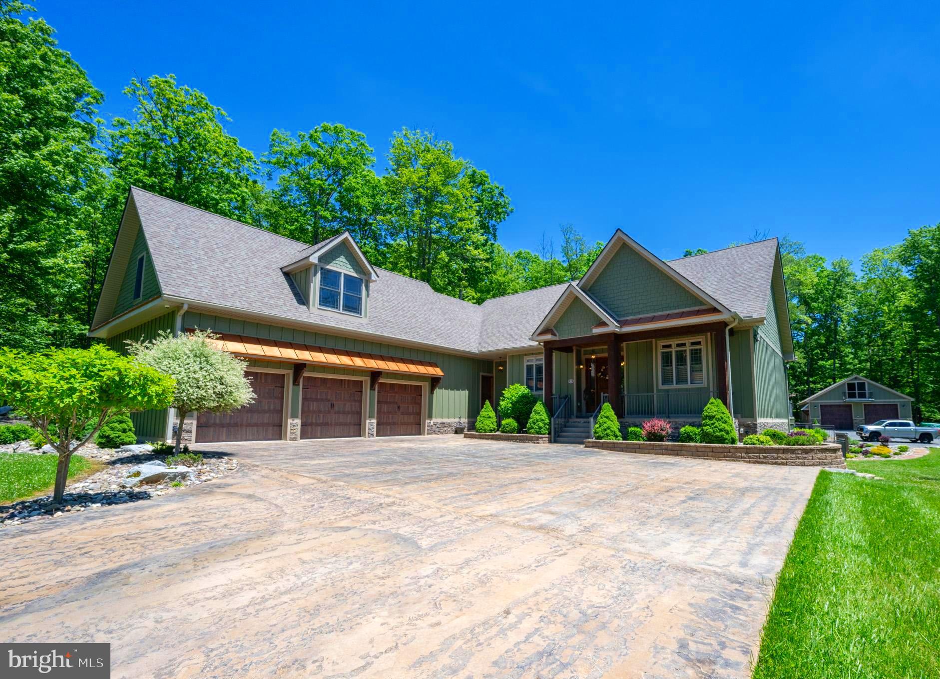 Exceptional craftsmanship and rustic charm come together at this beautifully built 3-bedroom, 2-bath home in McHenry. Thoughtfully designed with high-end finishes throughout, the home features three fireplaces, a dedicated home movie theater, and spacious living areas that blend comfort and character. Outdoor living is equally impressive, offering a gazebo with a fireplace and wood fire oven, a separate firepit area, a small pond, and plenty of space to relax and entertain. The attached 3-car garage includes unfinished upper-level space with potential for additional living area, storage, or a workshop, while the detached 2-car garage provides even more flexibility. Conveniently located just minutes from Deep Creek Lake, Wisp Resort, golf courses, restaurants, and area attractions, this exceptional property offers the perfect balance of privacy, luxury, and accessibility. Additionally, this property sits just outside the Deep Creek Lake Watershed Zoning area. A rare opportunity to own a truly unique property with quality construction, and endless possibilities. Call today to schedule a private showing!