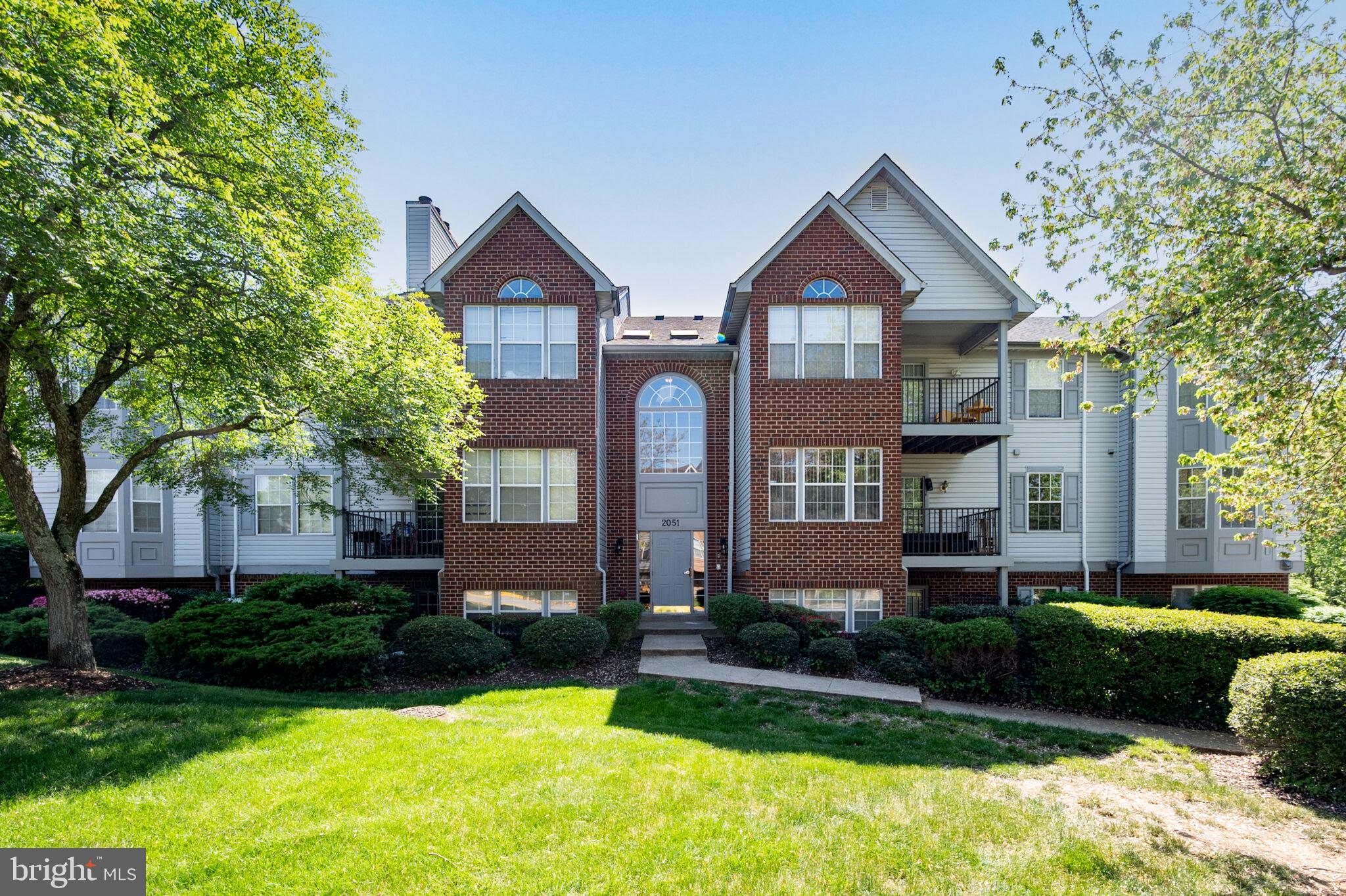 Welcome to a peaceful retreat in the heart of Oxon Hill, where comfort, natural light, and everyday convenience come together. This well-appointed condo offers a bright and inviting living space designed to feel like home the moment you walk in.

The sun-filled living room serves as the centerpiece, anchored by a cozy wood-burning fireplace that adds warmth and character. Large windows bring in natural light and create a relaxed, easy atmosphere—perfect for unwinding or hosting guests.

The efficient galley kitchen flows seamlessly into a flexible dining area, offering space for everyday meals, a home office setup, or a quiet reading corner. The layout is practical and adaptable to your lifestyle.

The spacious primary suite provides a comfortable retreat with a walk-in closet and private full bath. A second bedroom and additional full bathroom offer flexibility for guests or work-from-home needs.

Step outside to your private patio and enjoy peaceful wooded views—a quiet setting for morning coffee or winding down at the end of the day. A dedicated parking space (#31) adds everyday convenience.

Located just minutes from National Harbor, shopping, dining, and major commuter routes, this home offers easy access to Washington, DC, Virginia, and beyond.

A balanced blend of comfort, privacy, and location—this is an opportunity to enjoy low-maintenance living without sacrificing space or convenience.