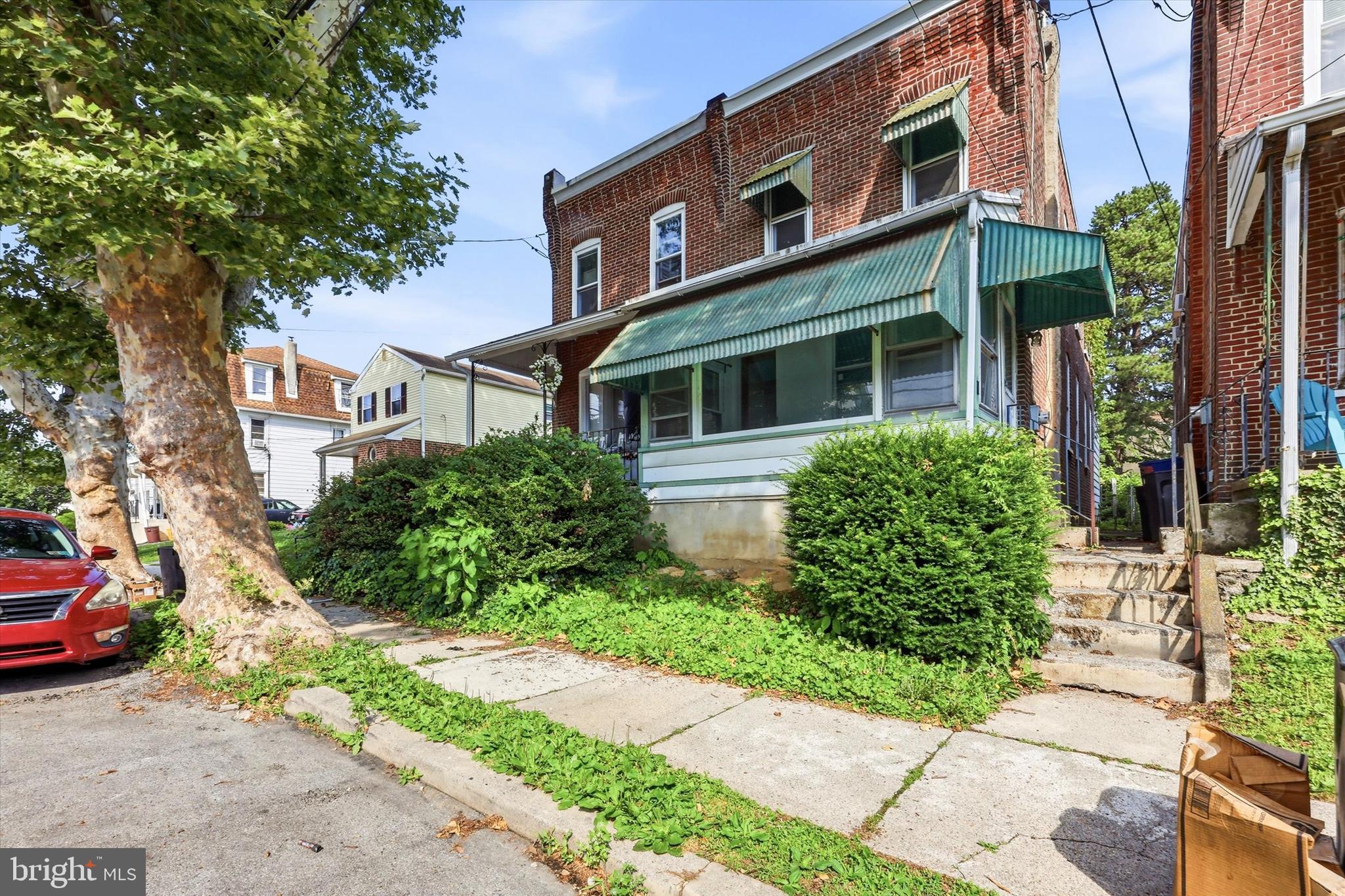 Welcome to this charming brick twin that seamlessly blends classic character with modern updates. An inviting enclosed front porch welcomes you into a spacious living room and formal dining room, both featuring beautiful hardwood floors. The updated kitchen offers ample cabinet and counter space, while a convenient first-floor laundry room and full bathroom add everyday functionality. Upstairs, you will find three generously sized bedrooms featuring brand-new carpeting and a second full bathroom. Enjoy outdoor living on the rear deck overlooking the fully fenced backyard, perfect for entertaining, gardening, or relaxing. Additional highlights include central air conditioning, a full unfinished basement providing abundant storage, and a combination of hardwood flooring and new carpeting upstairs! Ideally situated in a desirable neighborhood close to shopping, dining, parks, and major commuter routes, this move-in ready property presents a wonderful opportunity for its next owner.