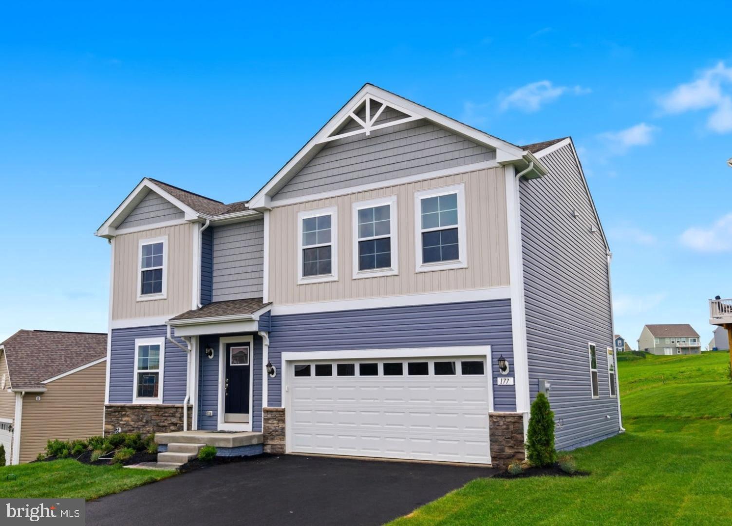 **UP TO $20K IN CLOSING COST ASSISTANCE FOR PRIMARY RESIDENCE  WITH USE OF APPROVED LENDER AND TITLE!**
MOVE-IN READY! Tour the Carnegie on a home with hilltop private backyard view. This home has a 42 ft. asphalt driveway & fully sodded yard w/front landscaping package. The front of the home offers horizontal, vertical & shake accent vinyl siding w/stacked stone water table. 2 car garage includes a Wi-Fi enabled garage door opener, 2 remotes, outdoor keypad and garage door w/top panel glass inserts. The garage is drywalled, taped and blocked and includes 2 additional ceiling lights and 2 GFI outlets. A covered front entry welcomes you inside to a spacious flex room with added window and ceiling fan/light prewire & data/Cable dual port. The entire main floor of this home features a durable and easy to clean, light Sunlit Beige resilient vinyl plank flooring a perfect choice for these high-traffic areas on the first floor. After you pass the convenient powder room on the left, enjoy the grand feel of the open kitchen-breakfast area and family room space. Deluxe stainless appliance package includes a 5.3 cu. ft. 5 burner gas range with Extra Large Integrated Center Burner, Express Pre-Heat, Crisp Mode, Edge to Edge Cooktop, and a 15,000 BTU Power Boil Burner. The 1.7 cu. ft. microwave includes a built in two speed exterior venting system, sensor cooking controls, popcorn feature, express cook simplicity, and an add 30 seconds feature. The stainless interior Extra Large Capacity dishwasher features Dry Boost Technology, a Third Rack, Bottle Wash Jets, Adjustable upper rack, Steam & Sani High Wash Performance, Active Flood Protect, Piranha TM Hard Food Disposer, 47 dBA and optional Wi-Fi connectivity. Side by Side 25.3 Cu Ft. Refrigerator Fingerprint resistant refrigerator offers LED Lighting, Edge-to-Edge Shelves, advanced filtered water & ice dispensing, Open Door Alarm, Adaptive Freezer Defrost. This kitchen has a modern designer palate featuring Mission style creamy taupe Soft Close cabinets, pull out trays in lower cabinets, 42” upper cabinets that reach the ceiling and Matte Black cabinet pulls. Cabinet drawers offer full extension soft – close and dovetail ¾ “ thick plywood sides. Kitchen includes 18 sq. ft. prep island with pull out trash/recycling cabinet with convenient outlets on both sides of the island. Calacutta Dualina quartz countertops offer warm white background with gray and gold veins that create a captivating marble-like surface. A bold 3 x 12 glossy Charcoal backsplash, matte black gooseneck faucet w/sprayer and 41" 4 light graphite pendant light over the prep island provides the perfect balance of warmth and style. Kitchen features low profile energy efficient LED lighting and walk-in pantry. Sliding glass door opens to a 252 sq. ft. composite deck with steps to the fully sodded yard. Family room has 4 windows, LED low profile ceiling lights, ceiling fan/light prewire, wall mount pre-wire for cable-data, HDMI and outlet for easy TV installation. 2 pc Crown molding dresses foyer, flex area and family room and all windows are trimmed and cased with no dry wall returns. Home interior is custom painted with SW City Loft flat paint and gloss white trim. Climb the boxed oak stairs to the bedroom level to see upgraded pad and stain resistant carpeting. All bedrooms feature ceiling fan/light prewires with separate switches. Both full bathrooms offer 2 sink vanities, white ceramic wall tile w/glass corner shelves in bath/shower. Massive primary suite offers quartz undermount bathroom sink vanity top, step in shower with seat, linen closet & large walk-in closet. Both bathrooms feature elegant 12 x 24 floor tile. Unfinished basement includes 3-piece bath rough in, drywall ceiling, areaway exit and ceiling lights on switch. This home has a tankless hot water heater. Appointments recommended.