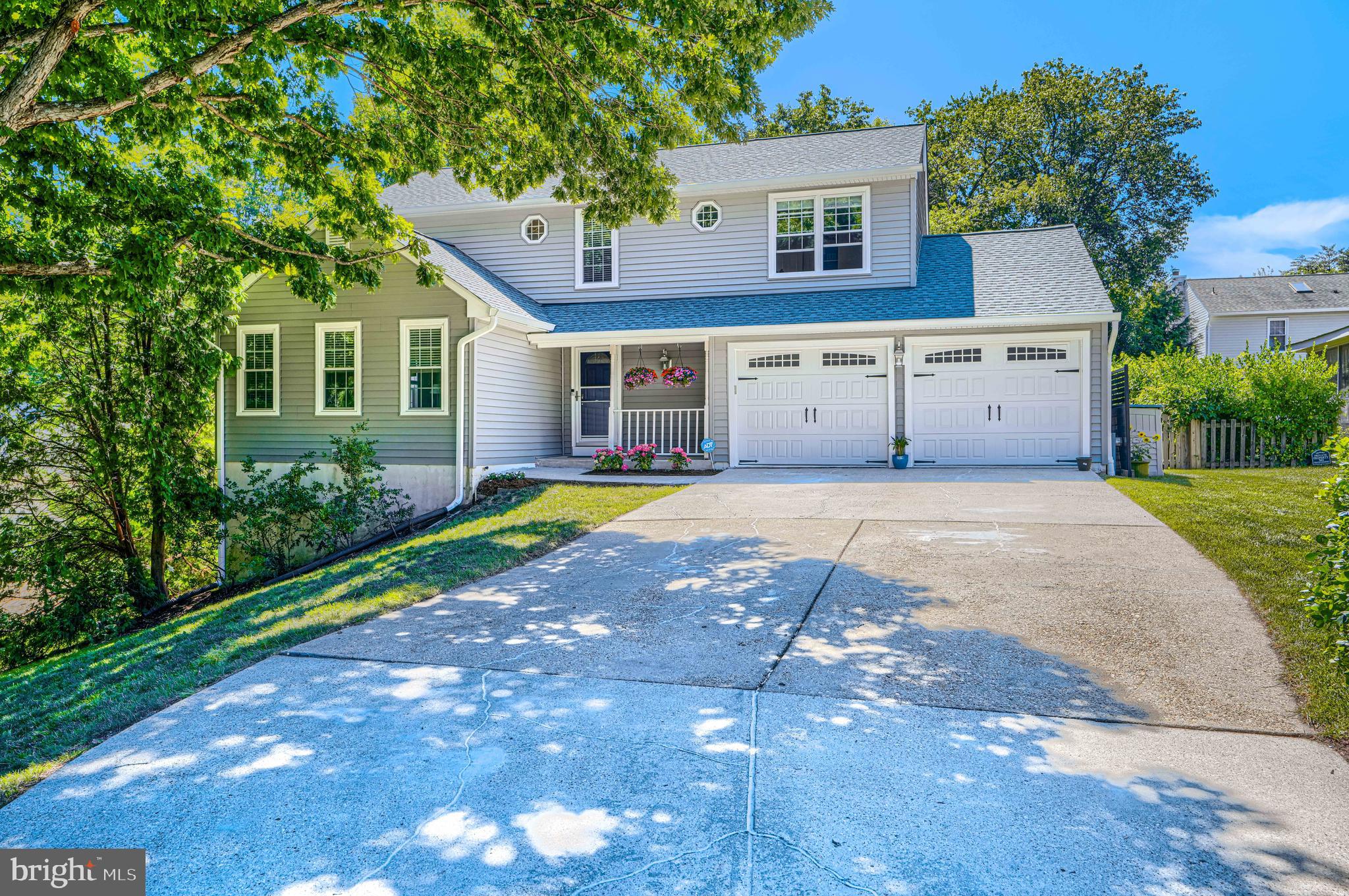 Welcome to this beautifully updated home in Stewart's Landing, one of Severna Park's most sought-after communities. Ideally situated at the end of a quiet cul-de-sac, this property offers a peaceful setting with seasonal water views and access to the exceptional neighborhood amenities that make Stewart's Landing so special.

This spacious home features 4 bedrooms and 2.5 bathrooms, including 2 full baths on the upper level and a convenient half bath on the main floor. A versatile bonus room in the finished basement provides the perfect space for a home office, gym, guest room, or playroom. Fresh paint and new carpet throughout create a bright, move-in-ready interior, while major exterior improvements—including a new roof, new siding, and new gutters—offer peace of mind for years to come.

The oversized 2-car garage provides ample room for vehicles, storage, and a workshop area. Outside, enjoy the rear deck overlooking the fenced backyard, an ideal space for entertaining, relaxing, gardening, or letting pets play.

Residents of Stewart's Landing enjoy access to a community marina nestled along scenic Old Man Creek, featuring 18 boat slips, a transient slip, boat launch ramp, storage racks for kayaks and SUPs, a community beach, and beautiful water views. Old Man Creek flows directly into the Magothy River and onward to the Chesapeake Bay, providing a protected and convenient gateway for boating, fishing, paddling, and waterfront recreation. The neighborhood park is just steps away, adding even more opportunities to enjoy the outdoors.

Combining generous living space, extensive updates, desirable community amenities, and a prime cul-de-sac location, this exceptional Stewart's Landing home offers a rare opportunity to enjoy the best of Severna Park living.