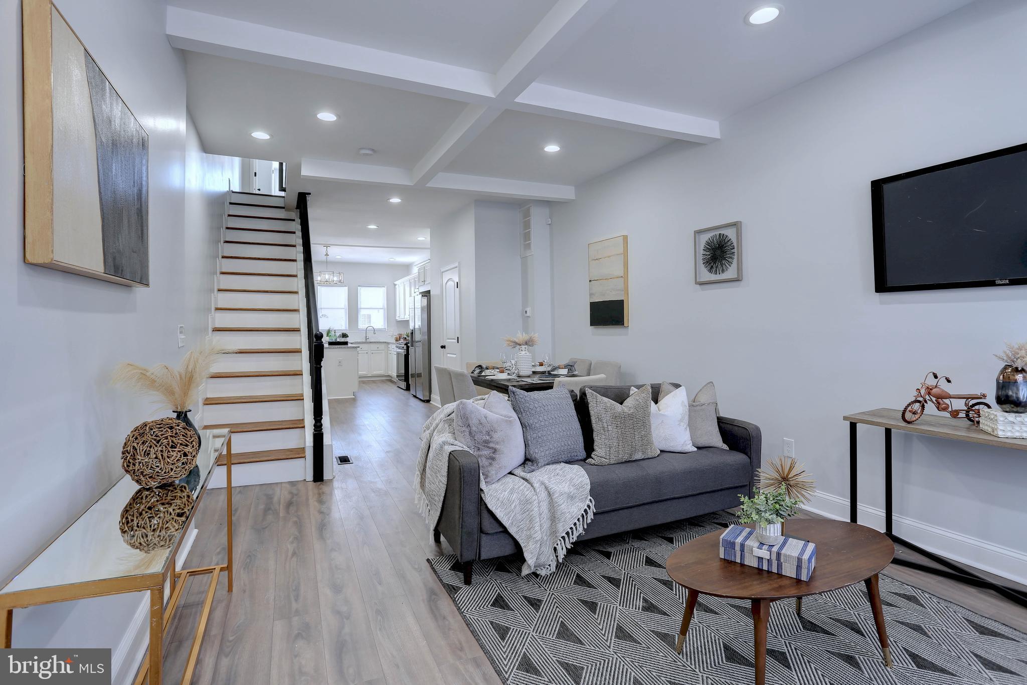 Stunning residence in the heart of Baltimore. 3 Bedrooms, 3  1/2 baths Plus a bonus room.—a perfect fusion of urban sophistication and timeless elegance. Recently renovated top to bottom to perfection!!! This architectural masterpiece pays homage to Baltimore's rich history, seamlessly blending classic charm with modern amenities. Every detail of this home reflects meticulous design and craftsmanship, ensuring a luxurious living experience for its fortunate owners. Step inside to discover an inviting, sunlit-filled living room. gorgeous kitchen with a designer island, granite countertops, stainless steel appliances, and a separate formal dining area—perfect for entertaining guests. The upper level is a sanctuary featuring an owner's suite with a full bath. A versatile bonus room ideal for an office, studio, or library.  Second bedroom with a conveniently located full bath in the hall. No more lugging laundry up and down stairs, as the washer and dryer are thoughtfully placed on the upper level. The fully finished basement offers a spacious family/rec room, a third bedroom, and a third full bath. Fully fenced rear yard. Situated in a great location, this home is convenient to Patterson Park, and Johns Hopkins Hospital. Immerse yourself in the local culture, and dine in renowned eateries, and desirable green spaces—all within blocks of your front door. 421 N Lakewood is not just a residence; it's a lifestyle—a true gem in Baltimore that promises an unparalleled living experience. Don't miss the opportunity to make this extraordinary property your home.