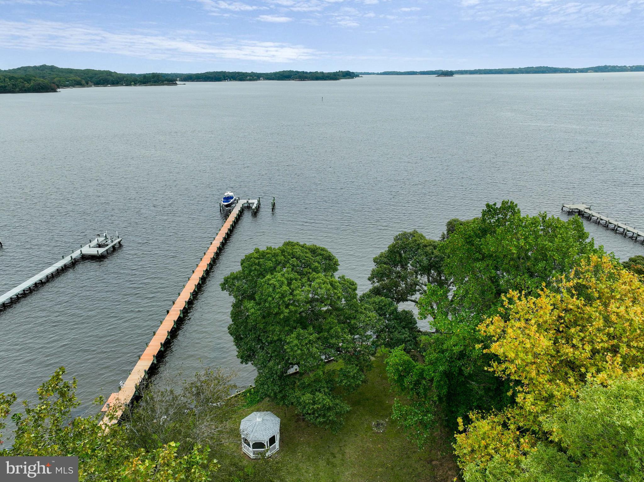 WATERFRONT.  New Construction with HUGE views. 5 bedroom, 5.5 bathroom, 65 ft of water frontage on the Magothy River. Permitting has started for the new home and pier. Still time to select finishes. Luxury Package includes all the expected high end finishes.  Tall Ceilings, walls of glass, Bosch Appliances, Hardie plank/shake siding, Kohler fixtures and quartz counters and backsplash. Optional Elevator.  Model Home available for buyers to walk.  Property has plenty of room for a swimming pool, sports court and an additional cottage. IDA zoning does not restrict lot coverage.  100% VA construction and other fantastic loan programs are available.  Go to WhitehallBuilding website for more information. Use this house plan or design your own with the builder.  Please do not enter driveway or property without a confirmed appointment.