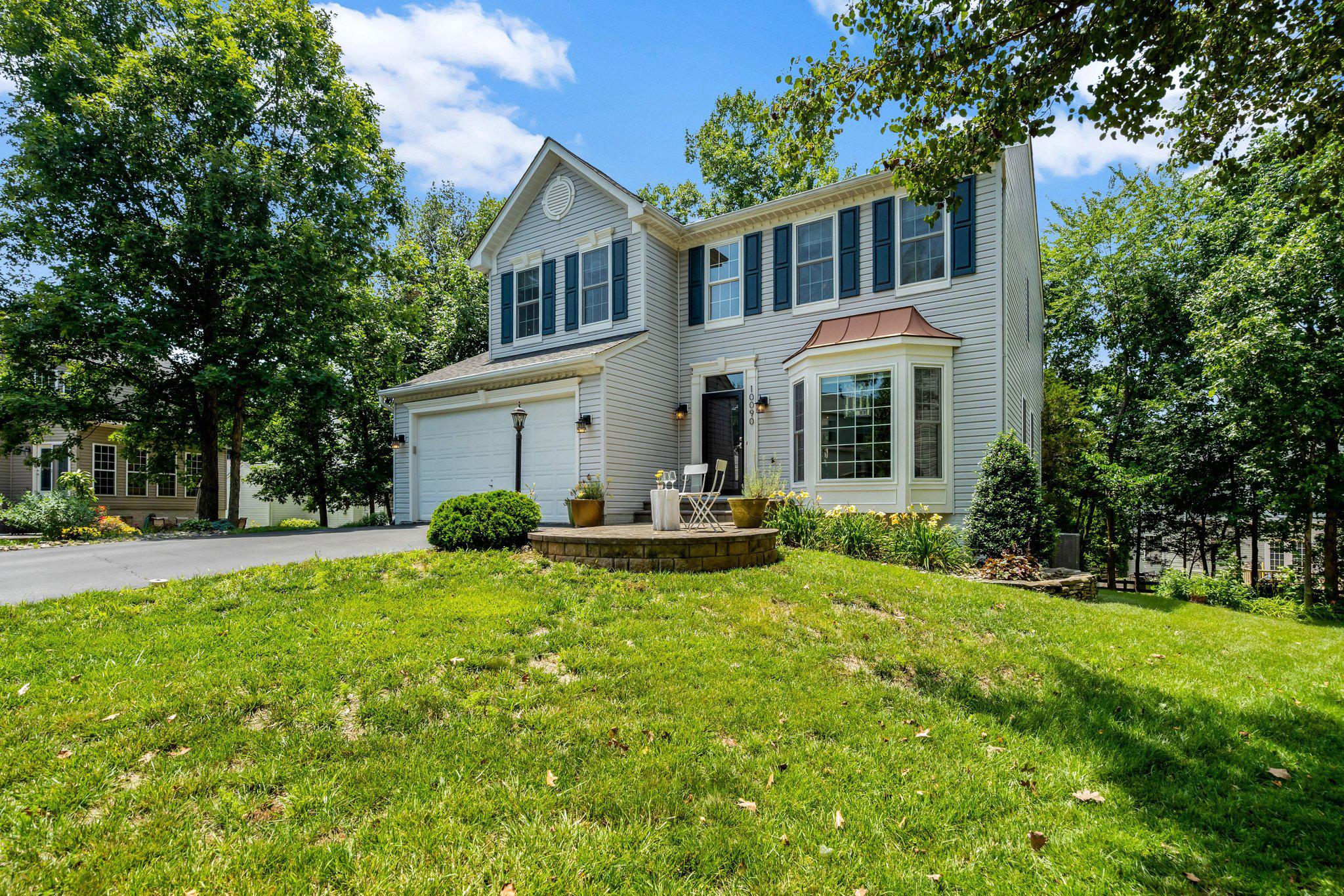 Welcome to an original owner home nestled on a stem street of 5 homes on Tummel Falls Drive in the Villages of Saybrooke within the popular Braemar community.  This 5 bedroom, 3.5 bath home was built in 1999.  Premium upgrades available from NVR (Ryan) homes at the time of the build, including selecting the largest lot of the 5 available in this section of lots.  The home has a 6-foot extension to the south side (fireplace side) of the house, adding to the spacious family room.  The garage has a 2-foot extension toward the front of the house, providing ample room for working around garaged vehicles.  The main level boasts 9-foot ceilings with transom windows in the family room and kitchen.  The gas fireplace in the family room is showcased by a stone surround, anchoring the room’s aesthetic appeal.  Not only is the main level filled with natural light from the abundance of windows, the light-filled aura continues in the lower level with a full-size sliding glass door walk-out and three full-size windows.  All windows in the house have been upgraded with Thompson Creek replacements in three phases from 2022-2024 carrying a 50-year warranty.  Enjoy the creative appeal of this home with its accent walls and artistic embellishments.  Many homes today are finished in a neutral palette throughout.  This home, however, displays a “joie de vivre” in its variety of finishes and atmosphere in different areas of the home.  It offers a respite from business and obligation.  All systems are newer and maintained ---Roof (2019), HVAC (2020), and a 75-gallon water heater (2021).  In addition, the Kitchen was remodeled in 2008 to include a Wolf 5-burner cooktop, Zephyr vent hood, and Silestone leather finish and quartz countertops.  More recently, appliance upgrades include a GE Profile wall oven and microwave (2017), GE Café refrigerator (2019), and Bosch dishwasher (2025).  The laundry room on the main level hosts a GE Profile washer and dryer installed in 2023.  A new owner can move in with confidence and comfort.  Relax outside on the spacious deck across the rear of the home.  Accessed from the family room/kitchen area it boasts a spacious area with bench seating and stairs to a separate level deck for a grill or smoker and a second set of stairs to the backyard patio.  Both deck and patio back to mature trees offering a natural setting.  Extend your rest and recreation areas by enjoying Braemar’s community amenities: community center and clubhouse, 2 pools, meandering trails, pickle ball courts, and more!