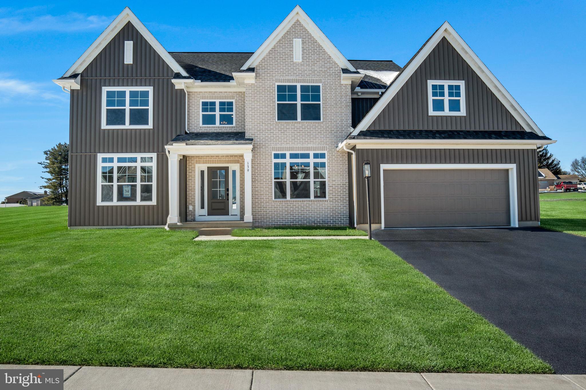 The Nottingham blends stately presence with modern-day comfort—offering 2,652 square feet of thoughtfully designed space that supports how families really live. From morning coffee to holiday dinners and everything in between, this two-story home puts flexibility and connection at the forefront. The open-concept kitchen, breakfast area, and family room flow together to create a light-filled hub ideal for both quiet mornings and energetic gatherings. The large walk-in pantry, mudroom, and spacious flex room just off the foyer make day-to-day life smoother and more organized—no matter how busy it gets. Upstairs, the second-floor owner’s suite becomes your personal escape. With its spa-style luxury bath, dual walk-in closets, and serene layout, it’s built for rest and rejuvenation. Three additional bedrooms and a second-floor laundry room bring added ease, while the open two-story foyer brings in natural light and a sense of airiness throughout. Whether you’re hosting Sunday brunch or settling in for a movie night, the Nottingham gives your family room to breathe, grow, and thrive.
