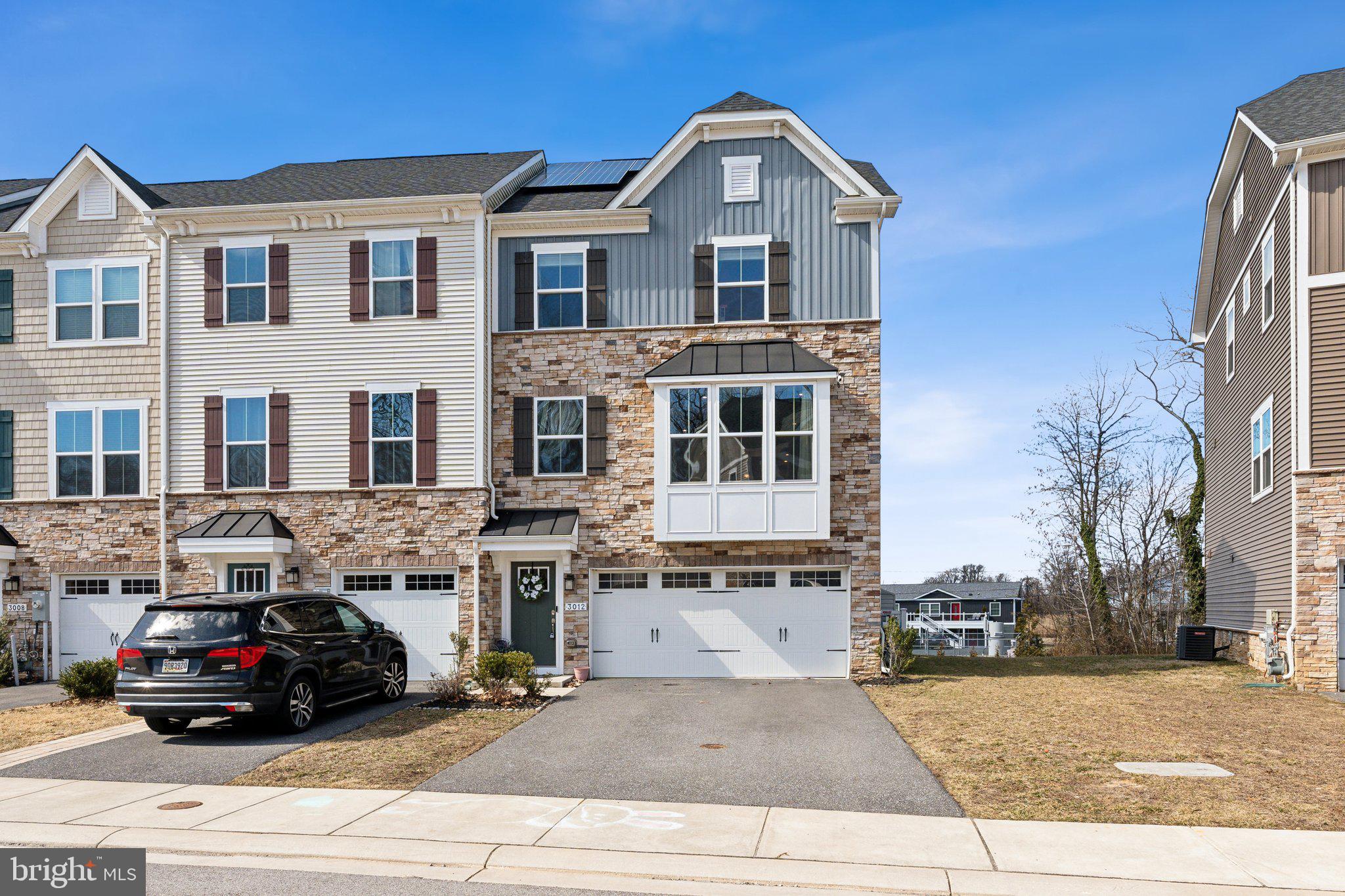 ***Seller is open to helping Buyer with closing costs!*** Feel free to ask us about a $15k forgivable grant that may be available to buyers for down payment or closing cost assistance as well... no  need to be a first time homeowner! 

Modern, functional, and move-in ready at Shaw’s Discovery community! This end unit, three-story townhome is the perfect place to call home. With an attached two-car garage, this house boasts three bedrooms, two full baths, two half baths, upstairs laundry, and tons of storage. The sellers have added a fully fenced-in yard, new back patio, updated appliances, play set, AND SOLAR PANELS **These are owned panels so get ready to save!** The lower level allows you to easily access the garage and backyard, and gives additional flex space to set up the area as an office, family room, playroom or gym. The main level is a flowing open-concept space with a deck off of the dining area (perfect for entertaining!). The well-kept neighborhood is complete with a community gate, pier, pavilion, walking path and restorative beach area. Another boat launch is located  nearby. Come see why this house makes it hard for the owners to leave!