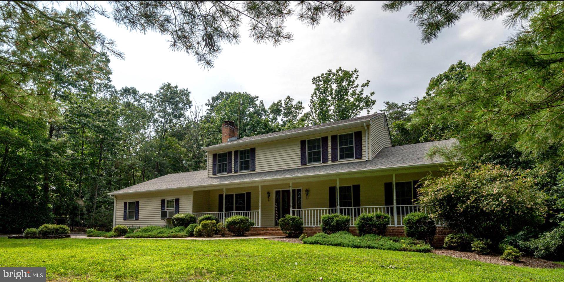 If you’re seeking a peaceful place with the ease of popping out to every convenience Leonardtown has to offer within a couple of minutes, without sacrificing being tucked away on a serene and sizeable landscape, this former custom builder’s home offers the perfect setting to settle into before summer ends. Sparrow Court is situated beautifully surrounded by just enough woods to offer both shade screening and privacy yet distanced and well maintained such that there’s so much space for sprawling lawn cookouts or setting up for soccer practice. The side-load upgrade to the oversized 2-car garage is a curb appeal enhancement, taking nothing from this traditional colonial with its long and roomy front porch to enjoy the sights and sounds of the rural living landscape. The driveway offers too many parking spots to count, making it easy to host many guests on the large upper deck or lower patio, with room perfect for entertaining small- or large-scale events at your new retreat. Inside, the bones of all three finished levels are beckoning to hold more beautiful memories, with a neutral interior awaiting your personal sense of style. Offering what most new builds don’t, Sparrow offers an abundance of fabulous storage opportunities with closets of every size and a huge fully conditioned storage room at walk-out level with its own access door. The main level offers a traditional layout with each room connecting to the other, making this an easy to entertain space, leading to the deck off the eat-in kitchen. The entryway and kitchen floors were replaced with a light, bright duraceramic, and the kitchen was refreshed with new stainless appliances and beautiful countertops. The kitchen cabinets were handcrafted by Woodburn Cabinets. Aside from the kitchen, there is a formal dining room, living room, large family room, huge laundry room with two closets, cabinetry, and a washer and dryer that conveys. The upstairs consists of a combination of bedrooms and baths, to include a primary closet the size of a small bedroom! The lower level is fully finished with expansive family room/rec room space, a wet bar, lots of closet space, and is a naturally well-lit walkout space with a large patio just outside. Beyond the amenities of the home itself, the Breton Bay community offers lifestyle. You can opt to purchase a membership with Breton Bay Country Club for golf, swimming, and restaurant enjoyment, and/or purchase annual water access privileges to include beach, pier, and playground with an incredible view!