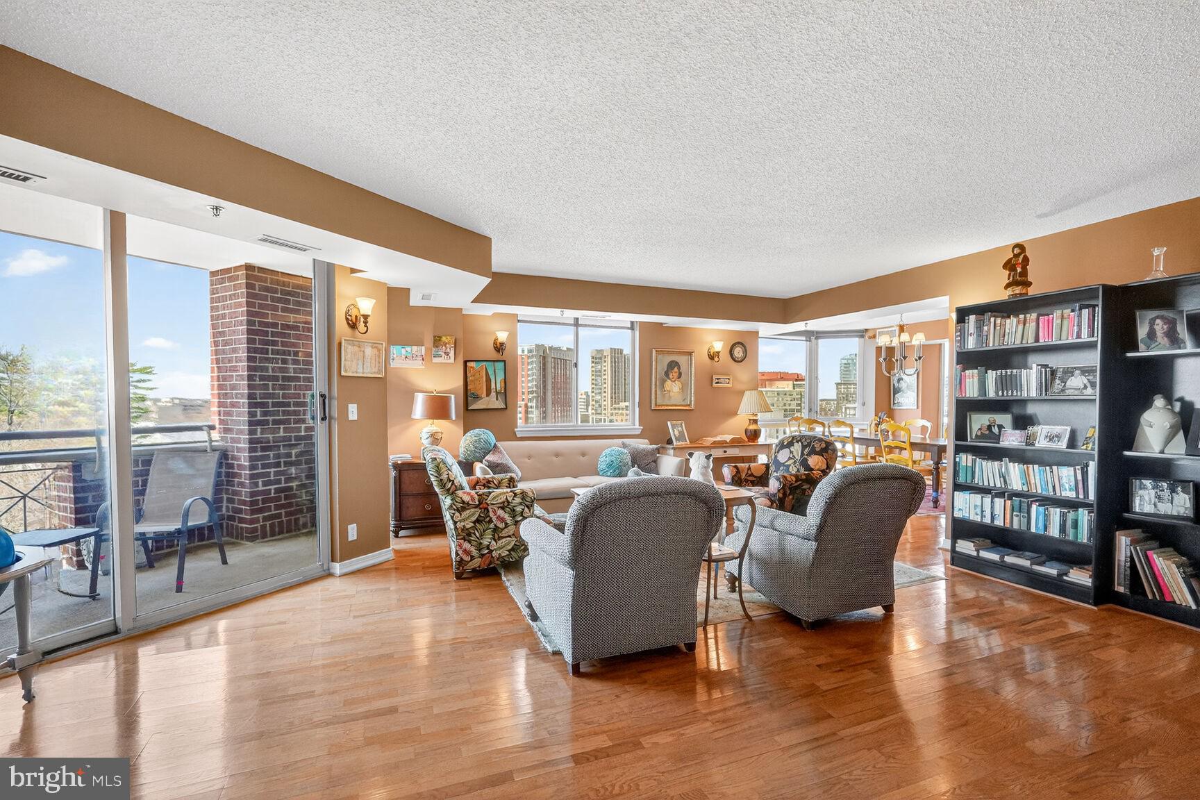 Luxury Condominium Residence at The Wisconsin Near Pike & Rose

An exceptional opportunity to own a rarely available luxury residence at The Wisconsin Condominium, ideally located in the heart of North Bethesda, just moments from the vibrant Pike & Rose district.

This impressive 3-bedroom, 3.5-bathroom condominium offers nearly 2,326 square feet of beautifully designed living space and is one of the largest residences in the building. Sunlight pours in from every direction, showcasing breathtaking panoramic views and creating a bright, welcoming atmosphere throughout. Gleaming LVP hardwood floors flow throughout the home, adding warmth and elegance to the expansive layout.

Designed for comfort and flexibility, the residence features 2 beautifully renovated bathrooms with granite countertops and elegant finishes. The home offers two spacious primary suites, each with its own private bath and generous closet space—ideal for guests or multi-generational living. A third bedroom includes custom built-in shelving and closets, providing exceptional storage and organization.

The expansive living and dining areas are perfect for both everyday living and entertaining. Mutiple built in bookshelves offer plenty of room to display your favorite books, prized collectibles or cherished photos.  3 mounted TV's convey. Two private balconies offer a peaceful retreat to enjoy morning coffee, evening sunsets, or beautiful seasonal views high above the surrounding neighborhood.

Located within a rare gated community, The Wisconsin Condominium offers both privacy and security—an uncommon and highly desirable feature in this sought-after area.

Perfectly positioned just steps from the energy of Pike & Rose, residents enjoy convenient access to parks, jogging trails, acclaimed restaurants, boutique shopping, and the nearby White Flint Metro Station. Daily conveniences are effortless with Whole Foods Market just one block away.

Residents of The Wisconsin Condominium enjoy an array of resort-style amenities, including indoor and outdoor swimming pools, tennis and racquetball courts, and a fully equipped fitness center.

The home also conveys two parking spaces (T3 #8A & #8B-tandem) and a private storage unit (Bin 31, Room 2) for added convenience.

Experience spacious luxury living, panoramic views, security, and an unbeatable location in one of North Bethesda’s most desirable condominium communities.

This exceptional residence is a rare offering.