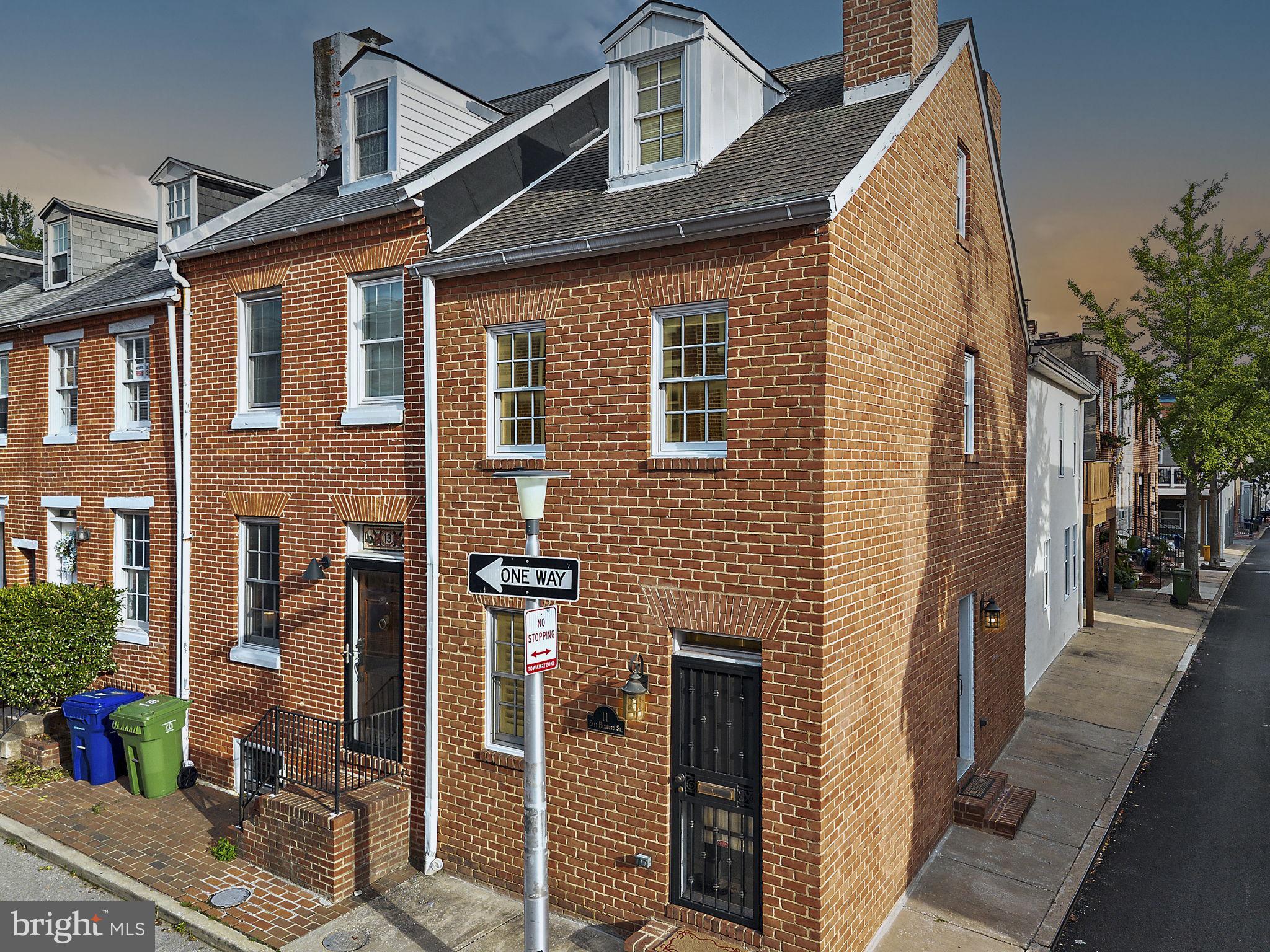 Welcome to 11 E Hamburg St, a meticulously renovated rowhome in the heart of Federal Hill. Featuring 3 bedrooms, 2.5 bathrooms and 2-car parking, this home perfectly balances historical character with contemporary comfort.

The main level features a spacious living room that flows seamlessly into a gourmet chef’s kitchen, designed as the heart of the home with professional-series gas appliances and a large center island. Just beyond the kitchen you have the separate dining room, perfect for entertaining. The French doors in the dining room lead to the parking pad. As you head upstairs, the second level is bathed in natural light from creative skylights and features a serene owner’s suite with French doors leading to a private deck and a spa-like ensuite bath with a jetted tub. You also have a second bedroom and additional space off the landing, perfect for an office. The third floor showcases the home’s original character with beautifully restored heart pine floors and an additional spacious bedroom, while the finished lower level provides a versatile recreation room and a separate laundry room.

Situated in a premier location, this home offers the rare city luxury of dedicated parking, ensuring convenience in one of Baltimore’s most sought-after neighborhoods. You are in immediate proximity to the historic Cross Street Market, the iconic overlooks of Federal Hill Park, the excitement of Camden Yards, and so much more!