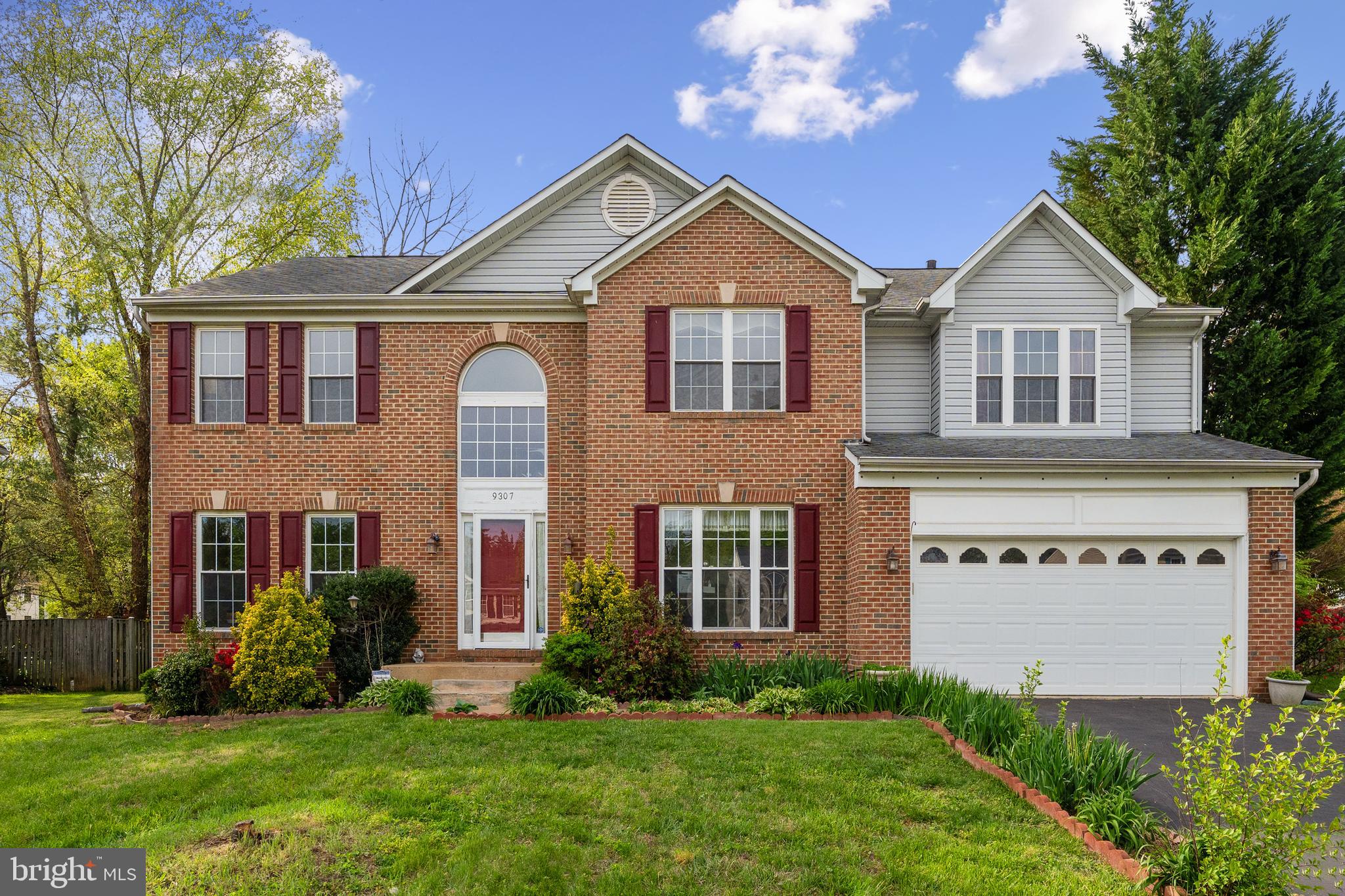Welcome to 9307 Whitt Dr in sought-after Blooms Crossing!

This stately brick-front colonial offers over 4,800 square feet of beautifully finished living space and is one of the largest floorplans in the neighborhood. Tucked into a quiet section of Manassas Park, this home checks all the boxes—space, updates, and a prime lot.

Upstairs, you'll find an ultra-rare layout with five spacious bedrooms, including an oversized primary suite with vaulted ceilings and a cozy gas stove—your perfect retreat.

The main level boasts elegant hardwood floors, formal living and dining rooms, a private home office or den, and an updated kitchen featuring granite countertops and stainless steel appliances.

The fully finished basement offers plush carpeting, a sixth bedroom, and a third full bathroom—ideal for guests, a second office, or multi-generational living.

Step outside to your expansive deck overlooking a fully fenced, flat backyard—plenty of room for entertaining, play, or pets. Plus, enjoy the convenience of a two-car garage and peace of mind with a new HVAC system installed in 2019.

Don’t miss your chance to own this stunning home in a prime location!