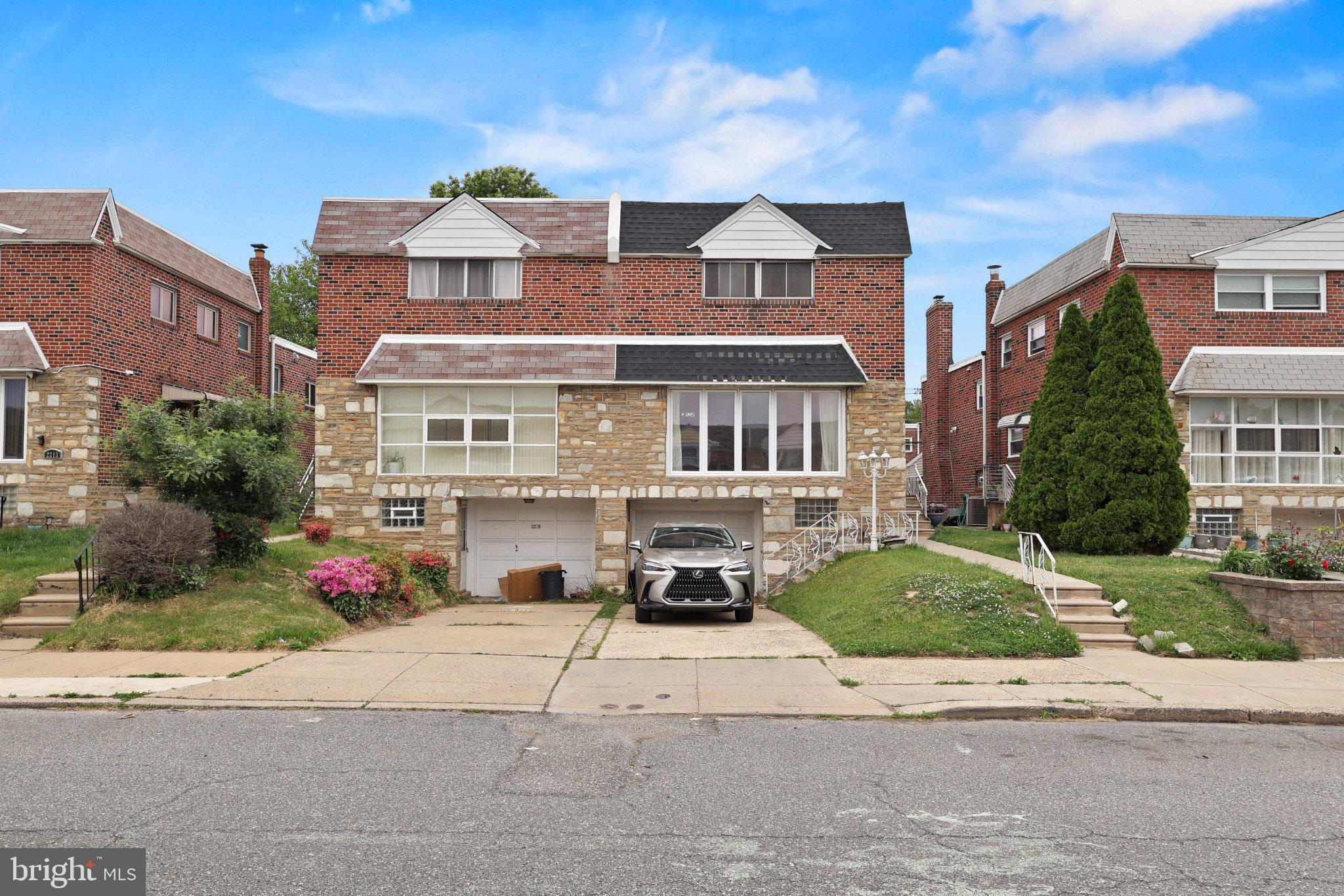 Welcome to 2217 Hoffnagle Street, a beautifully maintained 4-bedroom, 2.5-bathroom semi-detached twin in the heart of Northeast Philadelphia’s sought-after Rhawnhurst section. This home offers a thoughtful multi-level layout designed for both privacy and seamless entertaining.

The main level features a bright, expansive living room anchored by a large picture window that floods the space with natural light. The open-concept dining area flows directly into the kitchen, which is equipped with newer appliances and updated recessed lighting.
The unique multi-level design provides exceptional flexibility. The lower-level walk-out family room serves as a perfect den or media space, with sliding doors leading to a private rear patio and a spacious backyard. The four bedrooms are strategically placed across the upper levels, ensuring everyone has their own quiet retreat.

Key Features & Updates:
* Upgraded Systems: 100-amp electrical service and energy-efficient natural gas heating with central air conditioning.
* Modern Touches: Beautiful hardwood and tile flooring throughout, accented by modern replacement windows.
* Outdoor Living: Large private backyard and a paved patio ideal for summer BBQs.
* Parking: Private driveway plus a detached 1-car garage.
* Location: Situated in a quiet residential zone just minutes from public transit, Roosevelt Blvd, and local shopping.

Move right in and experience the perfect blend of style, comfort, and convenience in one of the most desirable neighborhoods!