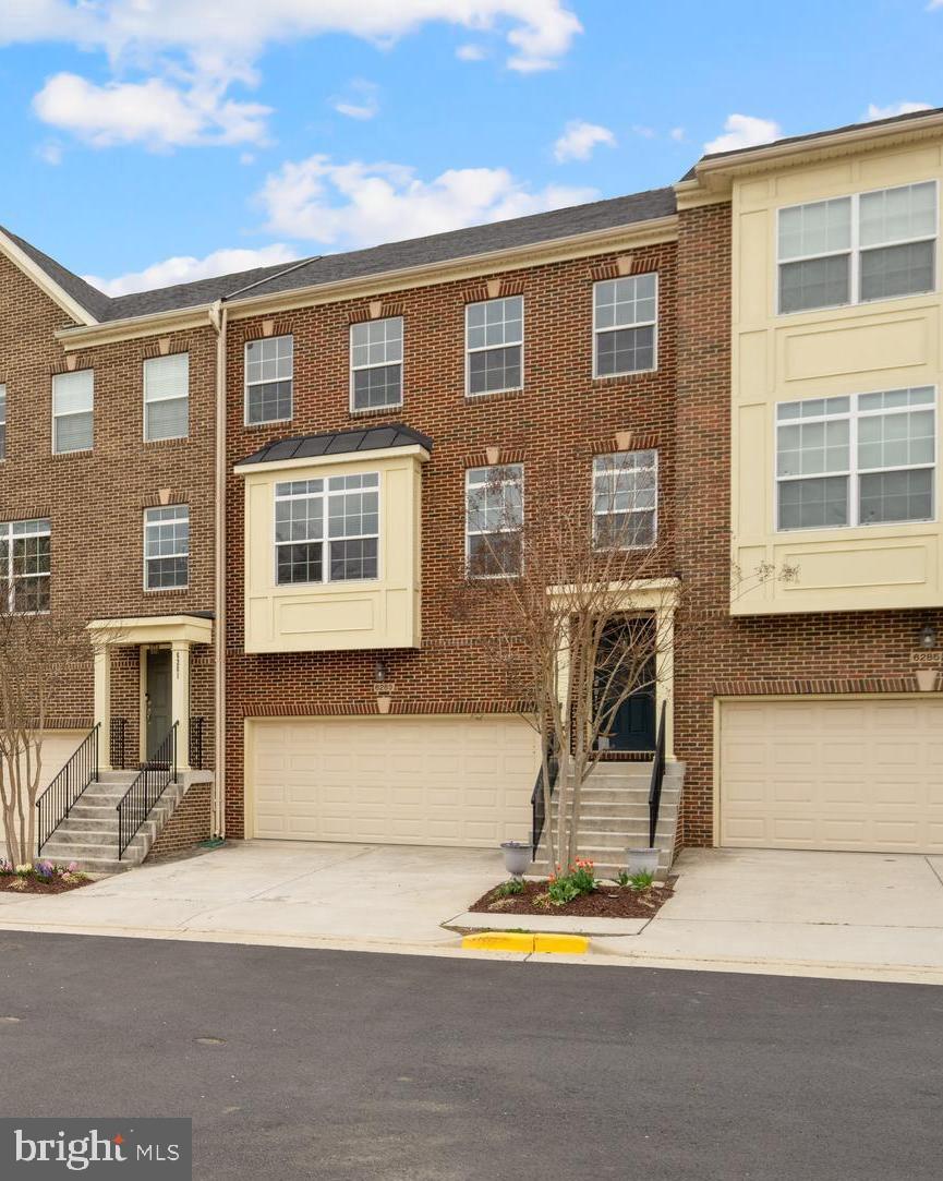 PENDING. OPEN HOUSE CANCELED! Townhome convenient living at its very finest. Prime location.  Enter into an elegant two-level foyer with showcase picture window. Bright three levels with upgrades like double crown molding, wainscotting, and a granite center island kitchen that's entirely open to the living room and dining room. Gather your friends in a more casual area in front of the cozy gas fireplace in the colder months and then throw open the sliding glass doors this time of year for the party to head straight out to the deck that overlooks flowering heavily-treed area. Huge primary bedroom with en-suite bath and two additional good-sized bedrooms and second full bath. Lower level is ready for whatever flex space you need - a gym, media center, game room or home office - sunfilled and totally finished - with direct access to the nicely planned lower level patio area. Rear yard fully fenced. Two car garage! Convenient to several major commuter routes and a stone's throw from the Huntley Meadows Park trails and playground. Available for move-in on June 9th.