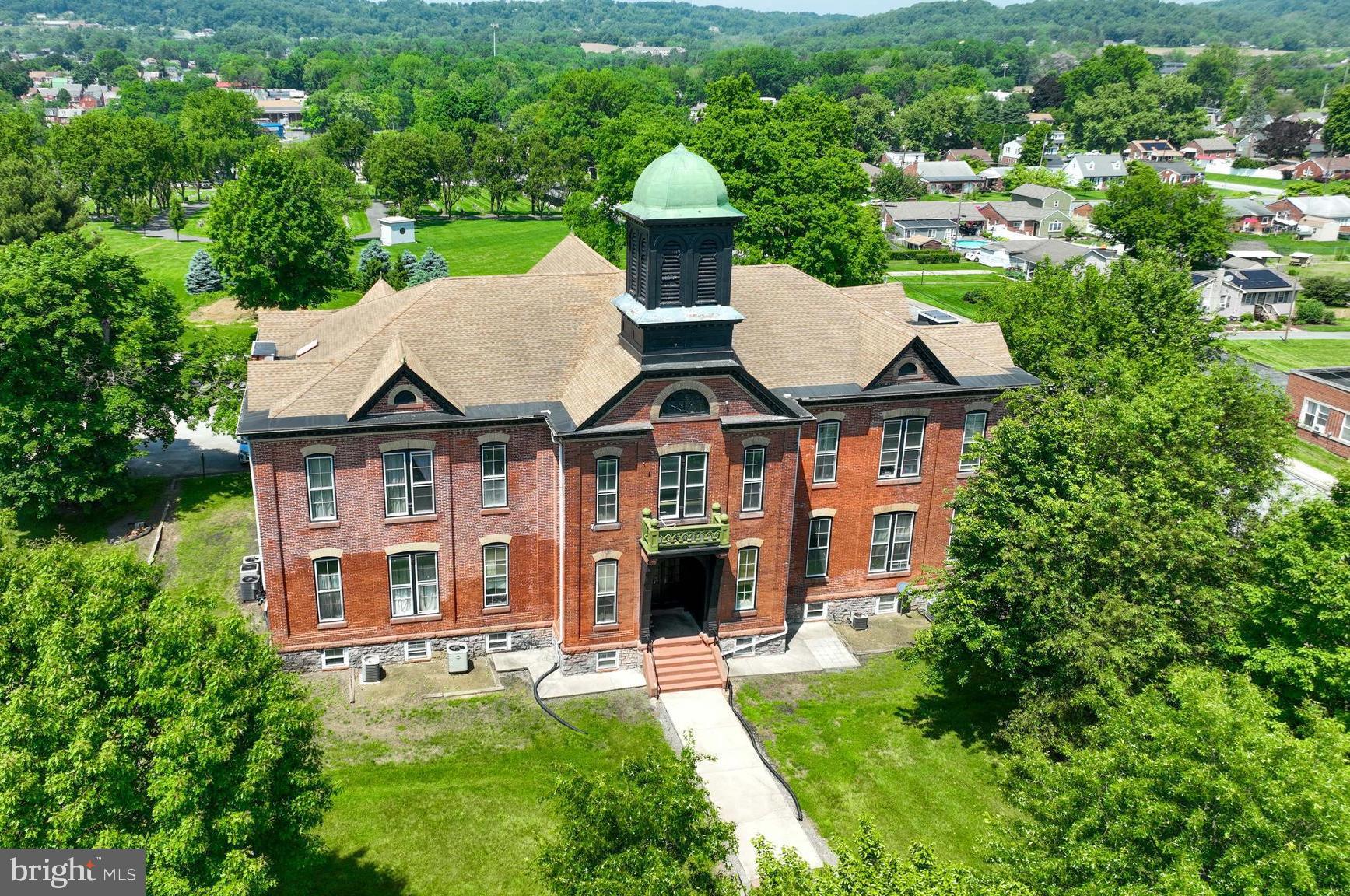 Welcome to unit 11 at the Manor School Apartments in Columbia, PA.  This is a one bedroom, one bathroom unit that's roughly 950 square feet located on the second floor.  Tenants will enjoy many updates such as the newly renovated kitchen, bathroom, natural light coming in from the large windows, high ceilings, new carpet, and fresh paint throughout.  There are standard sized common area coin-operated washers and dryers.  Tenant gets one designated parking spot, while the rest of the lot is first come, first serve.  Conveniently located near dining, shopping, route 462, and Highway 30, this is a move-in ready rental. Pets are welcome but restrictions apply. Apply today!