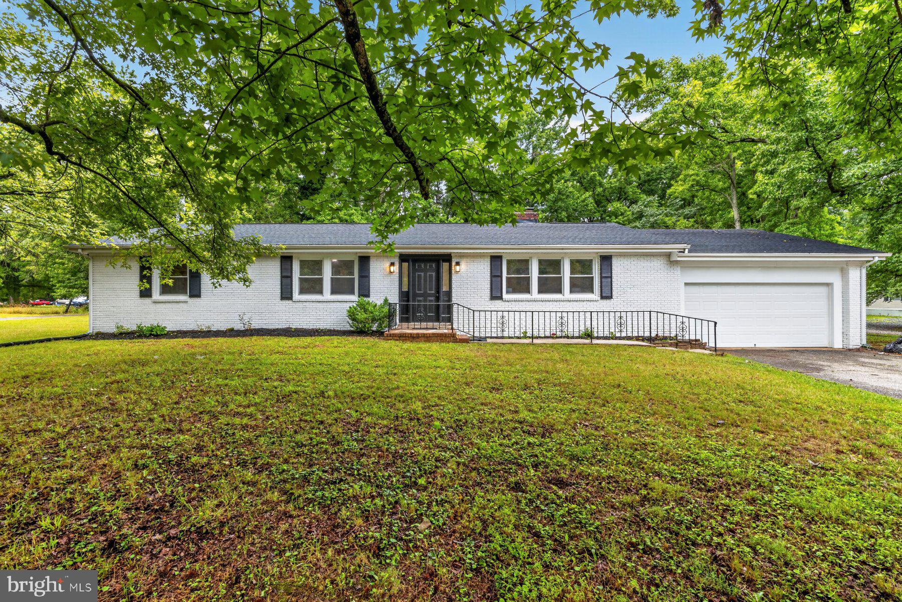 Welcome to this one-of-a-kind, fully updated rancher! Offering 5 bedrooms and 3 full bathrooms, this versatile home combines modern style, thoughtful design, and exceptional functionality—all within the desirable Broadneck School District! The main level features an open-concept layout with a stunning modern kitchen showcasing quartz countertops, stainless steel appliances, sleek finishes, and an inviting dining area centered around a charming brick wood-burning fireplace. An additional living room just off the dining area provides the perfect flex space for entertaining, relaxing, or gathering with family. Four spacious bedrooms, beautifully updated bathrooms, upgraded flooring, and contemporary fixtures complete the main level.

Need space for extended family, guests, or additional income potential? The separate 1-bedroom, 1-bath apartment offers its own beautifully finished kitchen with quartz countertops, stainless steel appliances, and the same modern finishes carried throughout the home, making it ideal for multigenerational living, a private guest suite, or potential rental opportunities where permitted.

Outside, enjoy a quiet, generously sized lot with room to entertain, garden, or simply unwind. The attached garage provides direct access into the living area, making everyday living and unloading groceries effortless. With designer finishes, flexible living spaces, and an unbeatable location just minutes from parks, beaches, shopping, dining, and commuter routes, this move-in-ready home truly has it all. Modern homes with this much versatility in Cape St. Claire don't come along often—schedule your private showing today!