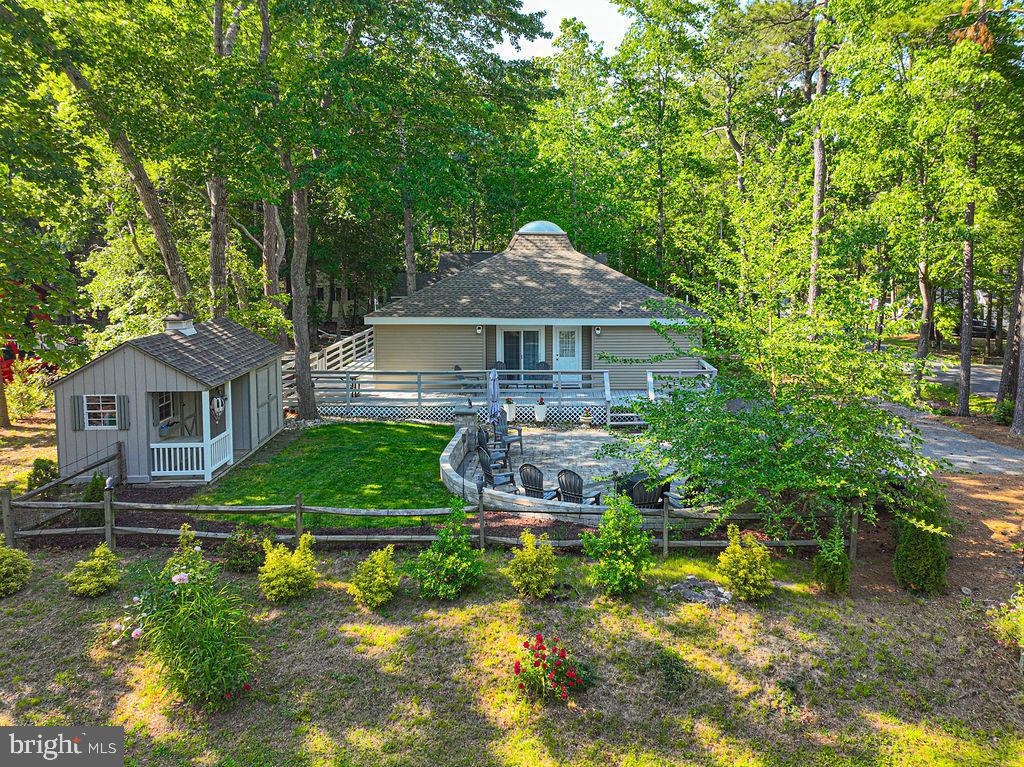Experience the ultimate beach lifestyle in this completely remodeled 3-bedroom, 2-bath coastal retreat loaded with over $142,000 in recent enhancements and upgrades. From the moment you enter, you’ll appreciate the stunning HDPA 3 patio sliding glass doors that fill the home with natural light and seamlessly connect indoor and outdoor living spaces. Cathedral ceilings with skylights and exposed wood beams throughout the home create a bright, open coastal atmosphere with exceptional architectural charm. The beautifully updated kitchen features new flooring, quartz countertops, and all-new stainless steel appliances, including a front-load washer and dryer installed in 2023. Comfort and efficiency are ensured with an American Standard 3-ton package HVAC system with 15kW backup heat. Major improvements include a new home and shed roof with upgraded plywood sheathing, a new hot water heater installed in 2026, and complete primary and guest bathroom replacements by Bath Fitter. Additional upgrades include a full crawl space encapsulation system installed in 2022, a professionally designed hardscape front patio with firepit, and extensive wraparound deck improvements featuring 100 replaced deck boards and new stairs leading to the Sundance Optima Spa added in August 2022. The professionally landscaped yard includes the addition of 11 holly trees by Roots Landscaping, enhancing both privacy and curb appeal. Every detail of this home has been thoughtfully updated, making this exceptional property truly move-in ready and perfect for enjoying coastal living at its finest. Call now for your private showing!