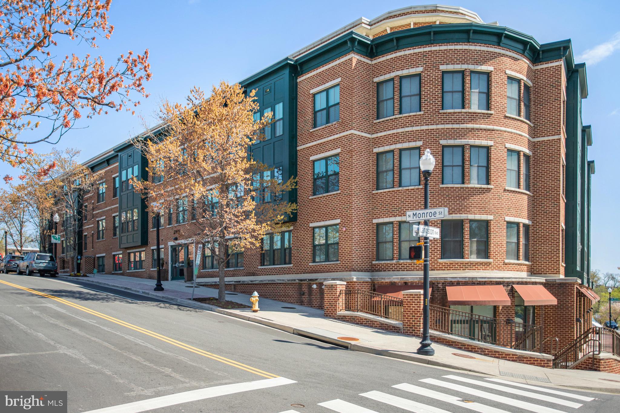 Spacious Sun-drenched Corner Unit in Contemporary, LEED-certified Arlington building  with 2 bedrooms, 2 full baths -- and 2 assigned garage spots! Stainless Steel Appliances,Granite Countertops, and Hardwood Floors throughout (No Carpet)! Home is freshly painted and move-in-ready. Enormous community courtyard terrace with outdoor summer seating and BBQ grills! Bus line out front, Custis Bike Trail into DC, blocks from Italian Store and Starbucks, & I-66 just 1 Traffic light away! Less than a mile to Ballston Metro This condo has it all!