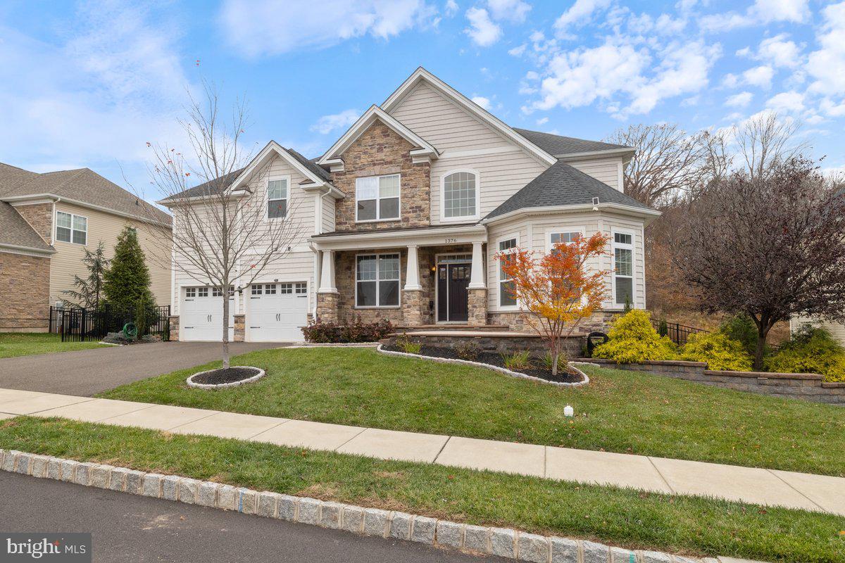 Welcome to 1376 Memorial Drive in Warwick Twp, PA, a Toll Brothers luxury home built in 2019 in the sought-after Woodlands of Warwick. This elegant residence spans 3,754 square feet, with an additional finished 1,500 square feet in the walk-out basement, all set on a 10,800-square-foot lot with serene wooded views.
Inside, the sophisticated interior welcomes you with a grand foyer and exquisite trim work, including crown molding and wainscoting, all contributing to an air of refined elegance. The living spaces are illuminated by top-of-the-line lighting systems, enhancing the home’s modern allure. The open floor plan connects the kitchen and the family room, featuring a stunning two-story stone fireplace and floor-to-ceiling windows that offer breathtaking views of the lush surroundings, offering a seamless connection to nature. Premium window treatments, including Hunter Douglas Roller shades, enhance privacy and style.
The main floor boasts a grand dining room and a library, offering an ideal setting for both formal gatherings and quiet reflection. It also includes a convenient laundry room, a half bath, and a private office with French doors, providing a quiet space for work or study. This home offers four bedrooms, while the finished basement features a fifth bedroom and full bath. The basement is an entertainment hub with in-ceiling speakers, an 80-inch HDTV, and pre-wired in-wall cables.
Outdoors, the property features a custom, maintenance-free deck with stair lights, a back patio with a pergola and built-in low voltage lighting, and a professionally landscaped property designed for continuous blooming, creating a picturesque setting year-round. Additionally, the outdoor space is equipped with speakers and a stereo receiver, perfect for creating an inviting atmosphere for entertaining guests.
Smart amenities include two thermostats, an LG smart refrigerator, washer, dryer, and a Ring Security System. A Level-2 EV Charging outlet is available in the garage. The professionally landscaped grounds offer continuous blooms, adding to the home's charm and beauty. Easy access to Warwick Memorial Park and the historic Moland House enriches your lifestyle with scenic walks.
Experience the pinnacle of elegance and modern living in this exceptional Toll Brothers home.