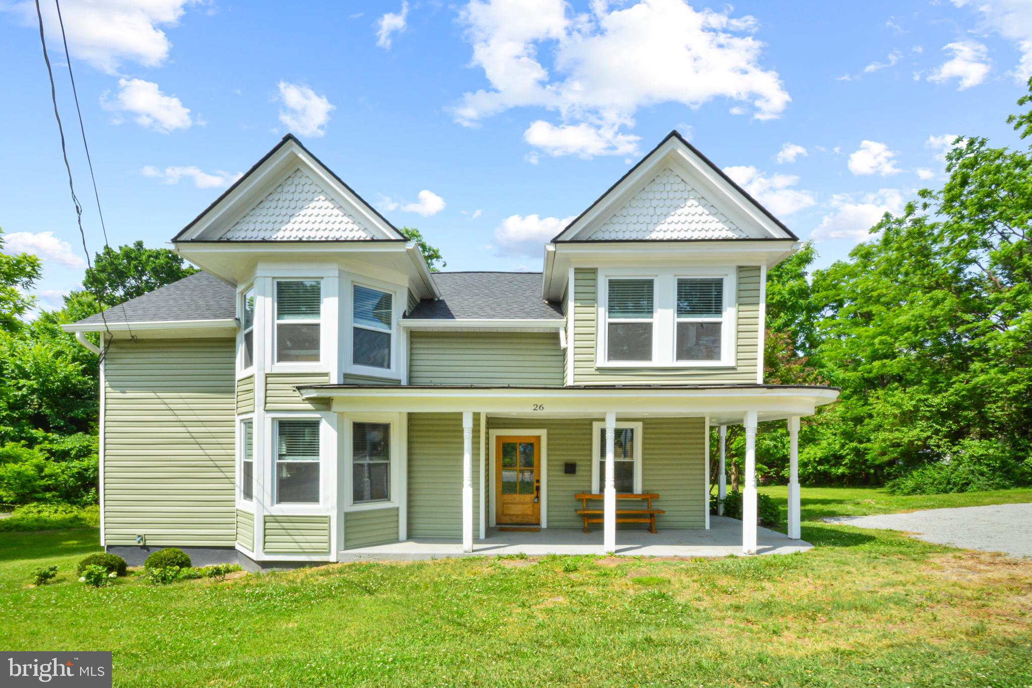 Charming 4-Bedroom Home in the Heart of Hamilton Village
Welcome to 26 W Colonial Hwy — a beautifully appointed 4-bedroom, 2.5-bath home nestled in the heart of Hamilton, VA, sitting directly across from Hamilton Park. With thoughtful updates and timeless farmhouse character throughout, this home is truly move-in ready.
Main Level
Rich hardwood floors set the tone the moment you walk in. The showstopping farm-style kitchen features a stunning island, stainless steel appliances, beautiful cabinetry with quartz countertops, and a spacious walk-in food pantry — a dream for anyone who loves to cook and entertain. The mudroom and laundry room is as functional as it is stylish, complete with a washer and dryer, tile flooring, and a charming farmhouse industrial sink in the adjoining half bath. Step outside and enjoy not one, but two covered porches — a welcoming front porch and a rear porch — perfect for relaxing in every season.
Upper Level
Upstairs, hardwood floors continue throughout all four bedrooms, creating a cohesive and polished feel. Two full bathrooms serve the upper level comfortably, offering plenty of space.
Outdoor & Yard
A beautifully maintained grass yard provides a lush, private retreat. A brand-new gravel driveway is being installed this week, and two storage sheds offer abundant space for tools, equipment, and more. Best of all, the home sits directly across from Hamilton Park — a rare and wonderful perk.
Located just minutes from local shops, dining, Rte. 7, and the W&OD Trail corridor, this home delivers the charm of small-town Hamilton living with easy access to everything Northern Virginia has to offer.
Schedule your showing today — this one won't last!