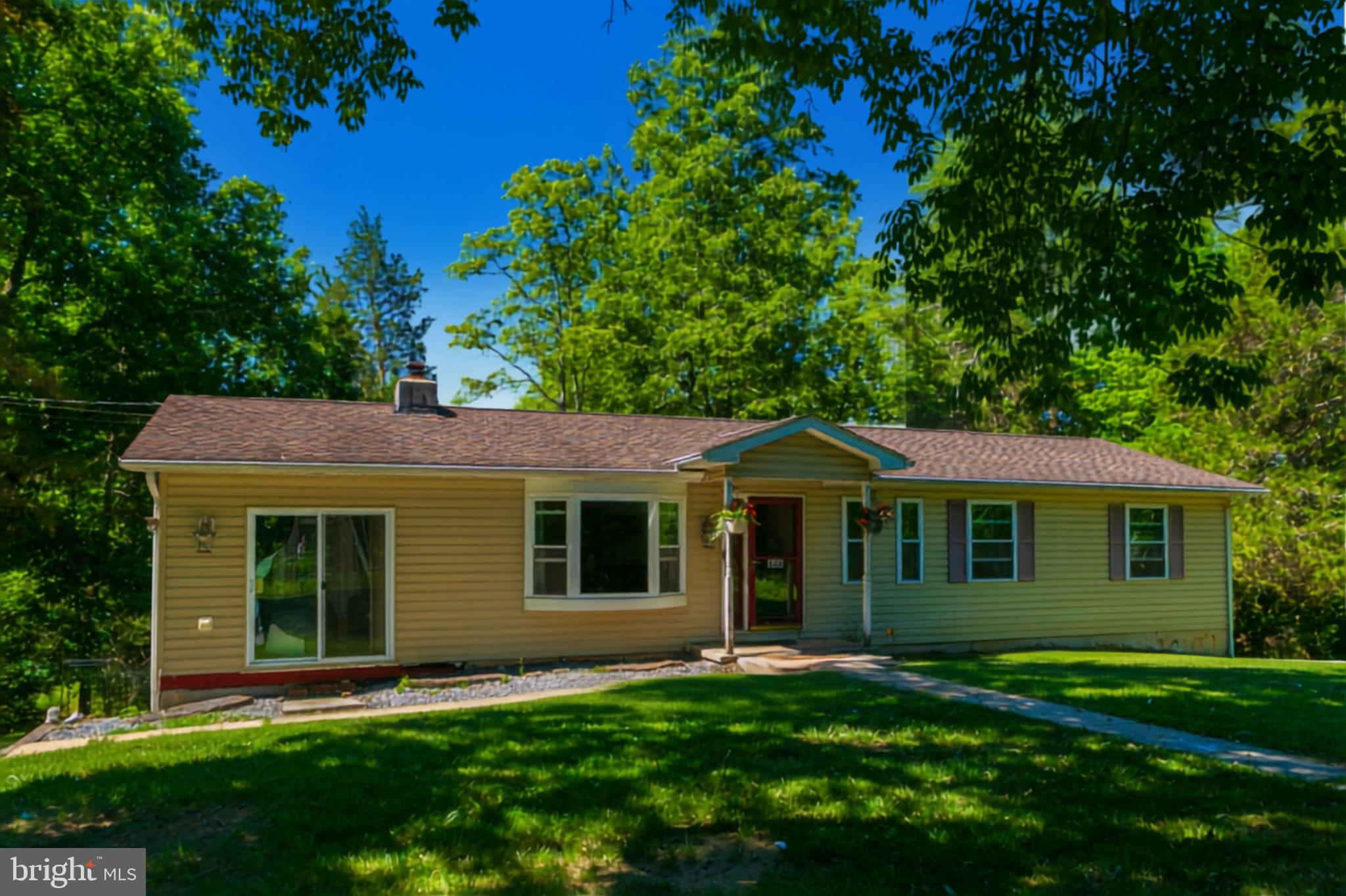 Opportunity awaits with this 3-bedroom, 1.5-bath ranch-style home situated on a spacious 0.51-acre lot. Offering 1,440 square feet of living space, this property is ideal for buyers looking to complete a renovation project and add their own personal touches.  Significant improvements have already been completed by the seller, including new insulation and drywall throughout, replacement doors and windows, a relined chimney for the wood stove, and a new well pump. Hardwood flooring can be found in the family room, kitchen, and primary bedroom, providing a solid foundation for the home's finishing touches.  The full unfinished basement features windows and offers excellent potential for additional bedrooms, recreation space, or expanded living areas. Even better, the sale includes additional parcels, including a buildable 0.56-acre lot. Combined, all parcels total an impressive 1.79 acres, providing plenty of room for future development, outdoor recreation, or added privacy.  No HOA.  This property is being sold as-is and will not qualify for government-backed financing programs. A great opportunity for investors, contractors, or buyers seeking a project with substantial potential.
