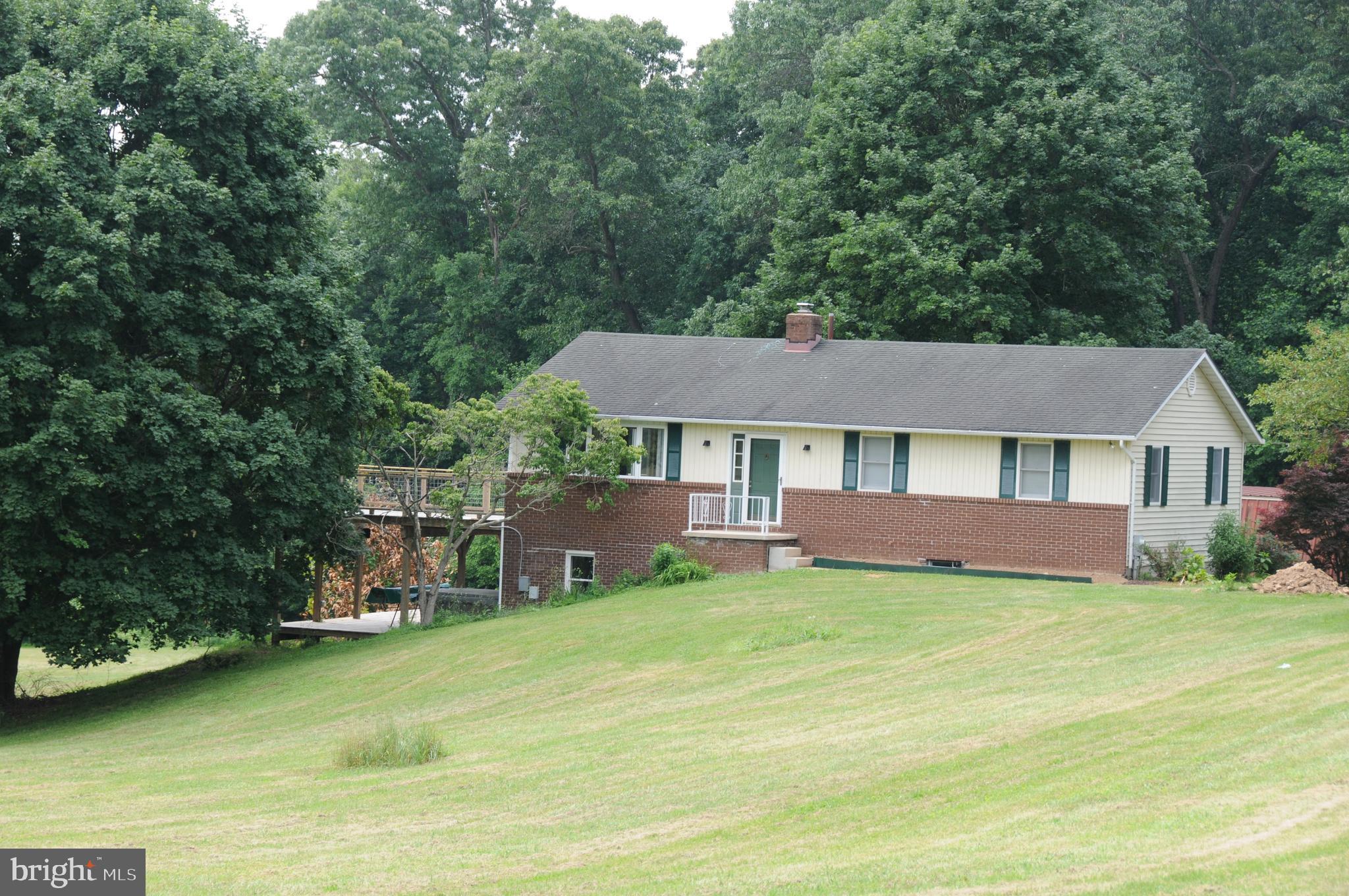 House sits approximately 300 foot from road . Very quiet neighborhood setting. Back deck overlooks one third of an acre pond. Metal building 48 x40 with car lift. Property sits on 5.1 acres and includes and additional 6.97 acres of usable BG&E right-a-way. If you love the country setting this is your pick, great
gentlemen's farm. Perfect for horses and livestock.