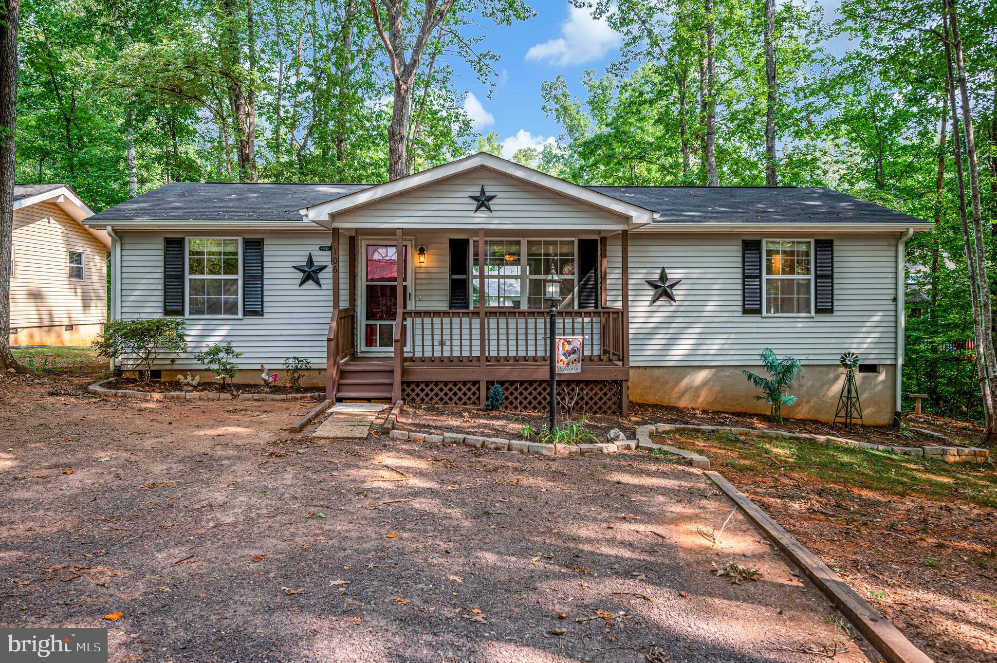 If you've been dreaming of life at the lake without sacrificing convenience, 106 Edgehill Drive in Lake of the Woods, is the perfect place to begin. Ideally located near the community's front gate, this charming one-level home makes daily commuting and running errands simple while allowing you to enjoy all the peaceful surroundings the community has to offer. From the moment you arrive, the inviting front porch welcomes you home. Add a porch swing or a couple of rocking chairs, and you'll have the perfect spot to relax, listen to nature, and enjoy the quiet lifestyle that makes Lake of the Woods so special. Step inside to hardwood flooring that greets you in the living room, creating a warm and inviting first impression. The thoughtfully designed split-bedroom floor plan offers separation between the primary bedroom and the additional bedrooms, providing privacy and functionality. All three bedrooms feature comfortable carpeting, while both full bathrooms include bathtubs, making everyday routines and clean-up time simple and convenient. The dining room features a sliding glass door that opens onto a generously sized deck, creating an easy flow between indoor and outdoor living. Whether you're hosting friends for a barbecue, enjoying a quiet evening outdoors, or simply soaking up the fresh air, the deck offers plenty of space to gather. Extending around the side of the home, the deck also provides direct access to the laundry room door, offering an additional entrance for added convenience. Whether you're purchasing your first home, looking to simplify with one-level living, or ready to embrace the Lake of the Woods lifestyle, 106 Edgehill Drive offers comfort, convenience, and a welcoming place to call home. With its practical layout, inviting outdoor spaces, and desirable location near the front gate, this home is ready for its next chapter.

Located in a private, gated, secure community, Lake of the Woods offers anything and everything you could want. Home to two lakes (the 550-acre main lake and a 35-acre "fishing lake"), a golf course, an equestrian center, a fire and rescue department, and a church all within the gates, Lake of the Woods has it all. Whether your passion is boating, water skiing, kayaking, golfing, horseback riding, or simply taking in the breathtaking views from the clubhouse while enjoying a fabulous meal, from your deck or yard, or from one of the beaches, you won't be disappointed! Perhaps you'd like a game of bridge or volunteer your time and talents...Lake of the Woods offers more than 60 clubs and organizations from which you may choose to become involved. Located in Orange County, we are fortunate to enjoy low real estate taxes. Coupled with home prices ranging from $275,000+ to over $2,000,000, Lake of the Woods is the perfect community for full-time residents and weekenders. But don't take my word for it, please come see for yourself! I will gladly give you a tour of Lake of the Woods by boat and by car so that you may experience what's to love in Lake of the Woods!