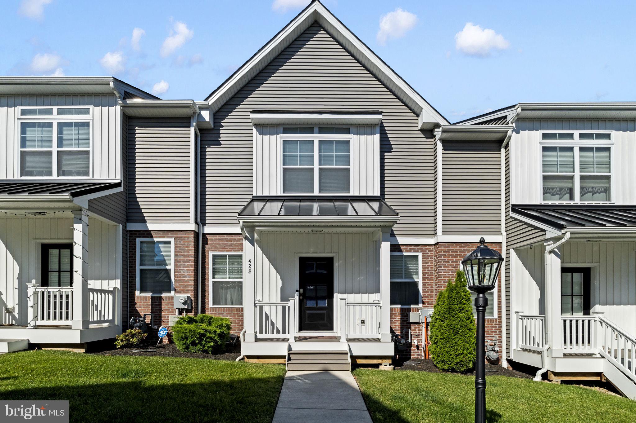 Welcome to 428 Hurst Street, a beautifully upgraded newer-construction townhome in the highly desirable Merion Pointe community of Bridgeport. Offering modern finishes, smart-home technology, and a prime location, this home is truly move-in ready and stands out from the rest.

Step onto the covered front porch and into a bright, open-concept main level featuring 9-foot ceilings, hardwood flooring, and an abundance of natural light. The spacious living and dining areas flow seamlessly into the stunning kitchen, which showcases 42" wood cabinetry, quartz countertops, a farmhouse sink, porcelain tile backsplash, pantry, breakfast bar/island seating, and GE stainless steel appliances. From the main living area, step outside to the maintenance-free deck with vinyl railings—perfect for morning coffee, outdoor dining, or relaxing with friends and family. A convenient powder room completes the main level.

Unlike many newer homes, this property has been thoughtfully enhanced with numerous owner upgrades throughout. Smart-home features include keyless entry locks, Ring doorbells at the front and rear entrances, smart kitchen lighting, smart smoke detectors, smart ceiling fans, solar-powered motion detector lighting at the garage entrance, and a Level 2 electric vehicle charging station. Additional upgrades include custom closet organizers, wood-look blinds, upgraded curtain hardware, a premium LG ThinQ French-door refrigerator, top-of-the-line washer and dryer, HD TV antenna wiring with access in every room, and high-quality scrubbable paint throughout the home in modern neutral tones.

The upper levels offer spacious bedrooms, generous closet space, stylish lighting fixtures, and well-appointed bathrooms featuring cultured marble vanities, ceramic tile flooring, and upgraded finishes. The primary suite serves as a private retreat with a large walk-in closet complete with custom organizers and a luxurious en-suite bath featuring an oversized vanity, designer tile shower, rain showerhead, linen closet, and elegant finishes.

The attached rear-entry two-car garage provides ample parking and storage, while the home's modern construction offers low-maintenance living and peace of mind.

Located in the award-winning Upper Merion Area School District, Bridgeport continues to thrive as one of Montgomery County's most exciting communities. Residents enjoy easy access to King of Prussia, Conshohocken, Plymouth Meeting, and Center City Philadelphia, along with local favorites including restaurants, breweries, parks, annual community events, and the Schuylkill River and Chester Valley Trails. Enjoy kayaking at Rotondo Riverfront Park, outdoor recreation at Bridgeport Memorial Park, local festivals, and everything this vibrant neighborhood has to offer.

This exceptional home combines luxury finishes, smart technology, and an unbeatable location. Schedule your private showing today and experience all that 428 Hurst Street has to offer.