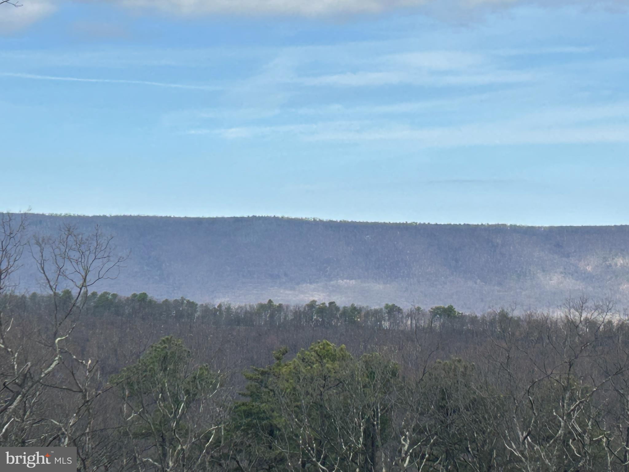 Tucked away at the top of a mountain, this 6.83-acre property consisting of home, two story workshop and storage shed offers the perfect blend of privacy, potential, and proximity. Whether you’re looking for an investment opportunity, a weekend retreat, or a full-time residence, this property delivers all three possibilities in one.
Just 15 minutes from a four-lane highway, 20 minutes from the National Forest, and within 30 minutes from several scenic lakes ideal for kayaking and fishing, you’ll enjoy both convenience and adventure. A quick half-hour drive to I 81 and less than two hours from Northern Virginia make this a smart location for commuters or those seeking an accessible mountain escape.
With a bit of sweat equity and creative vision, this diamond in the rough can be transformed into your dream mountain hideaway complete with sweeping views, fresh air, and endless potential.